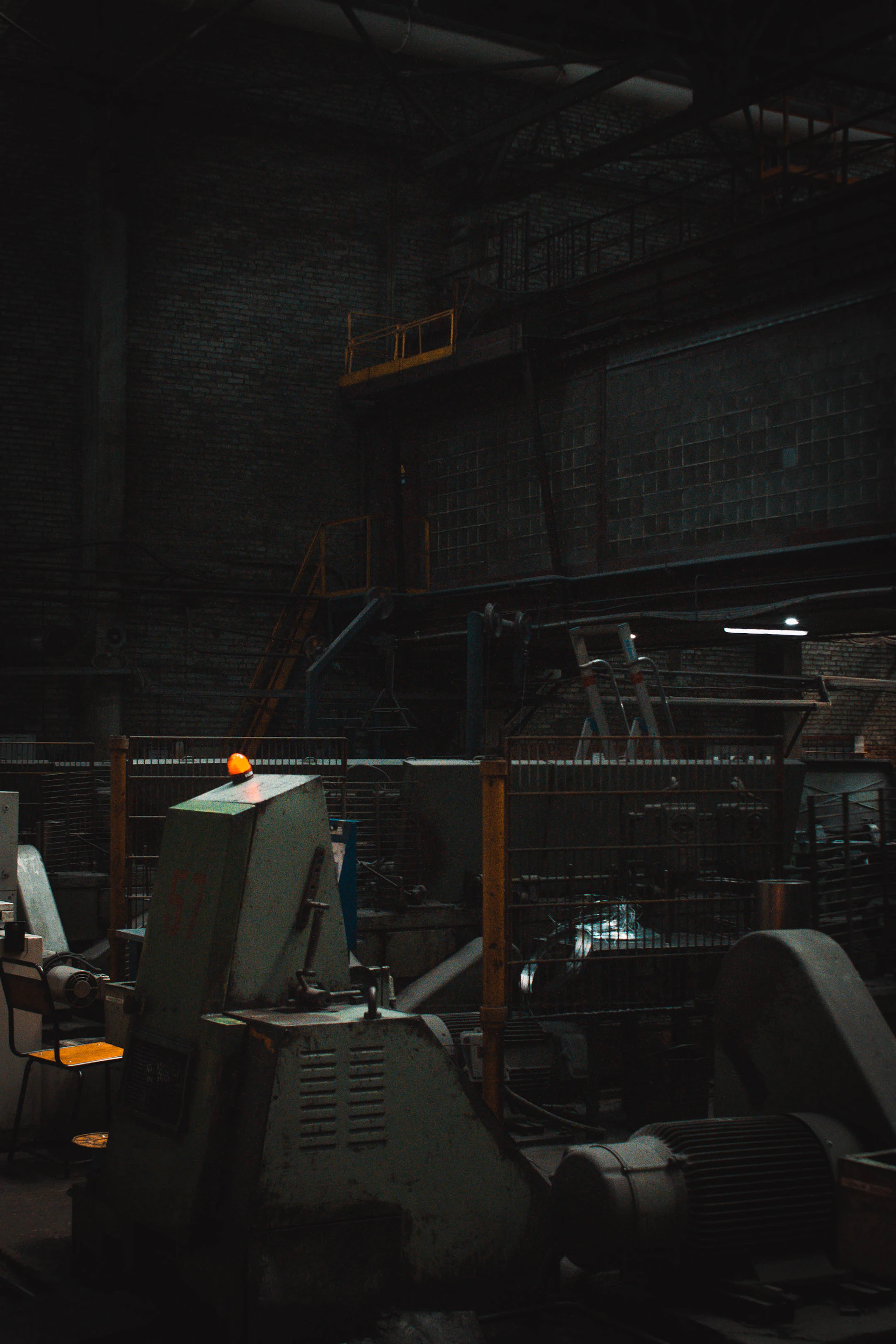 A man standing in front of a machine in a factory