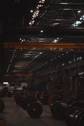 A large warehouse filled with lots of machines