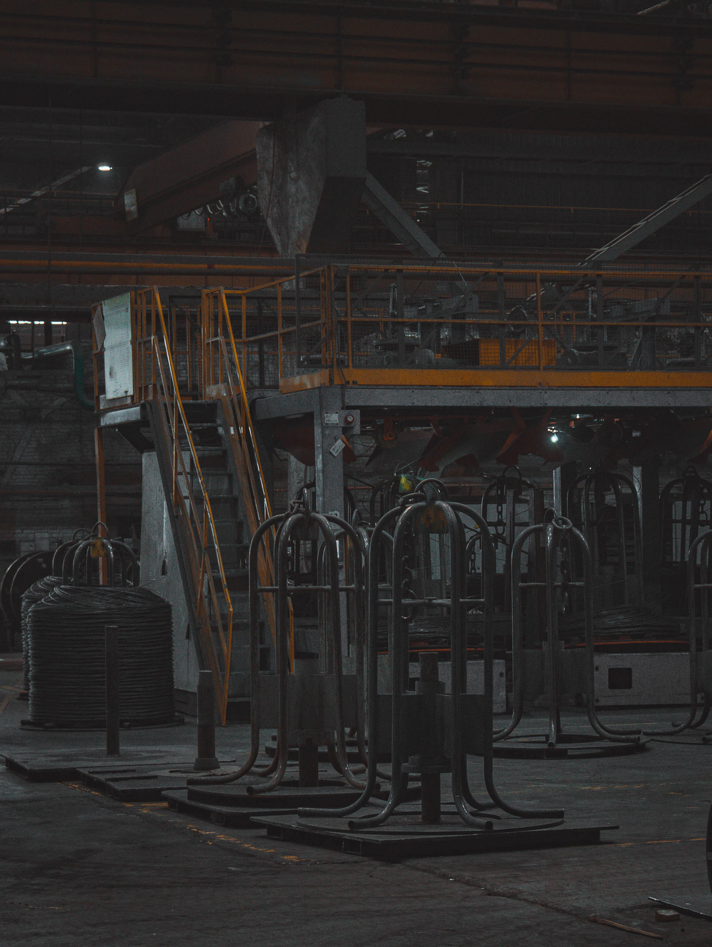 Dark industrial factory floor with heavy machinery