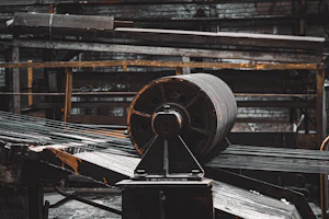 A machine is moving a large piece of metal