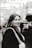 A woman in a black jacket is smiling