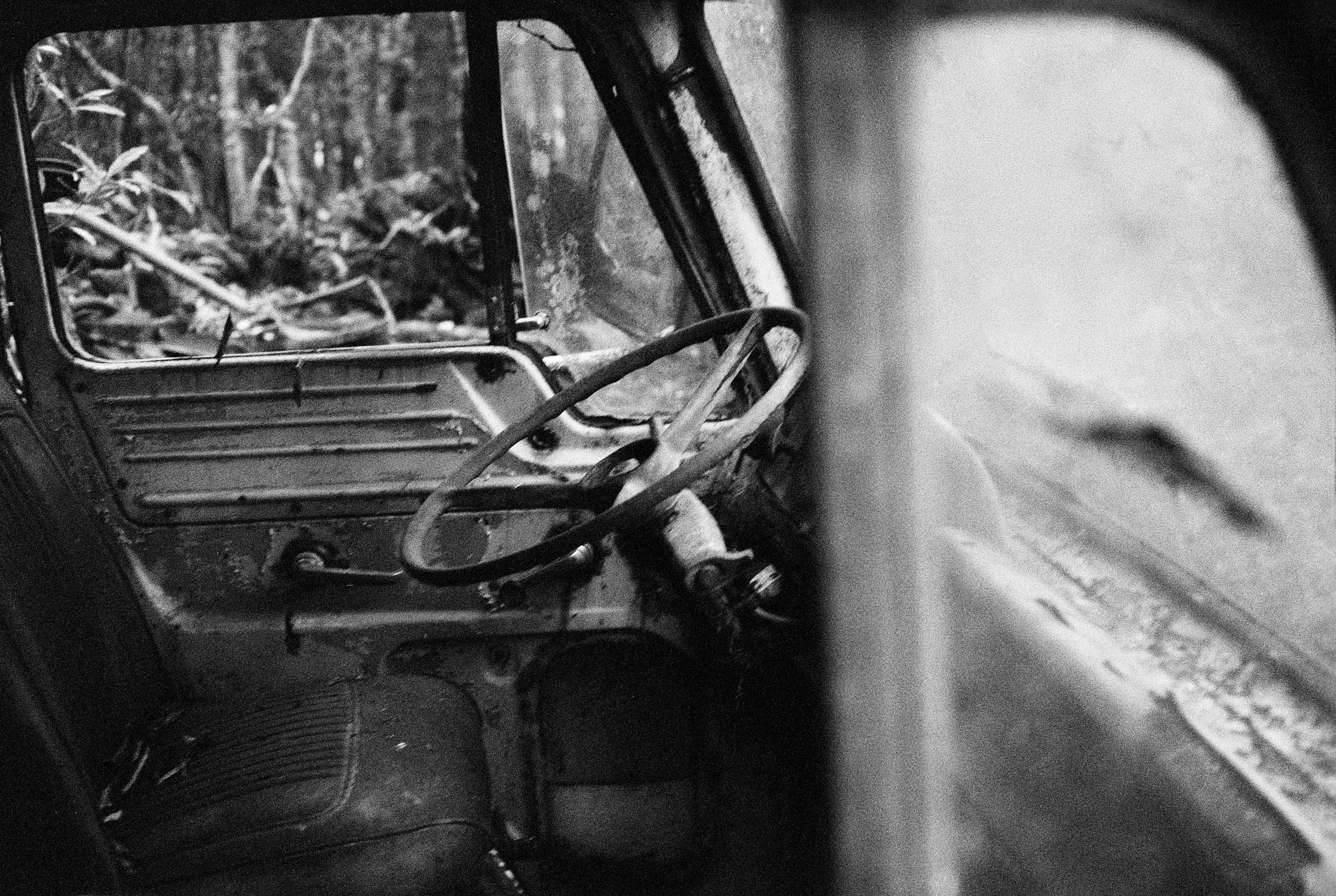 A black and white photo of an old truck