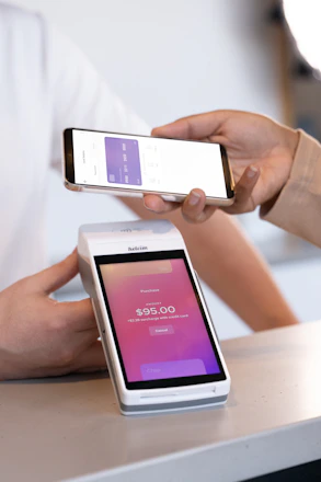 A person holding a cell phone in their hand