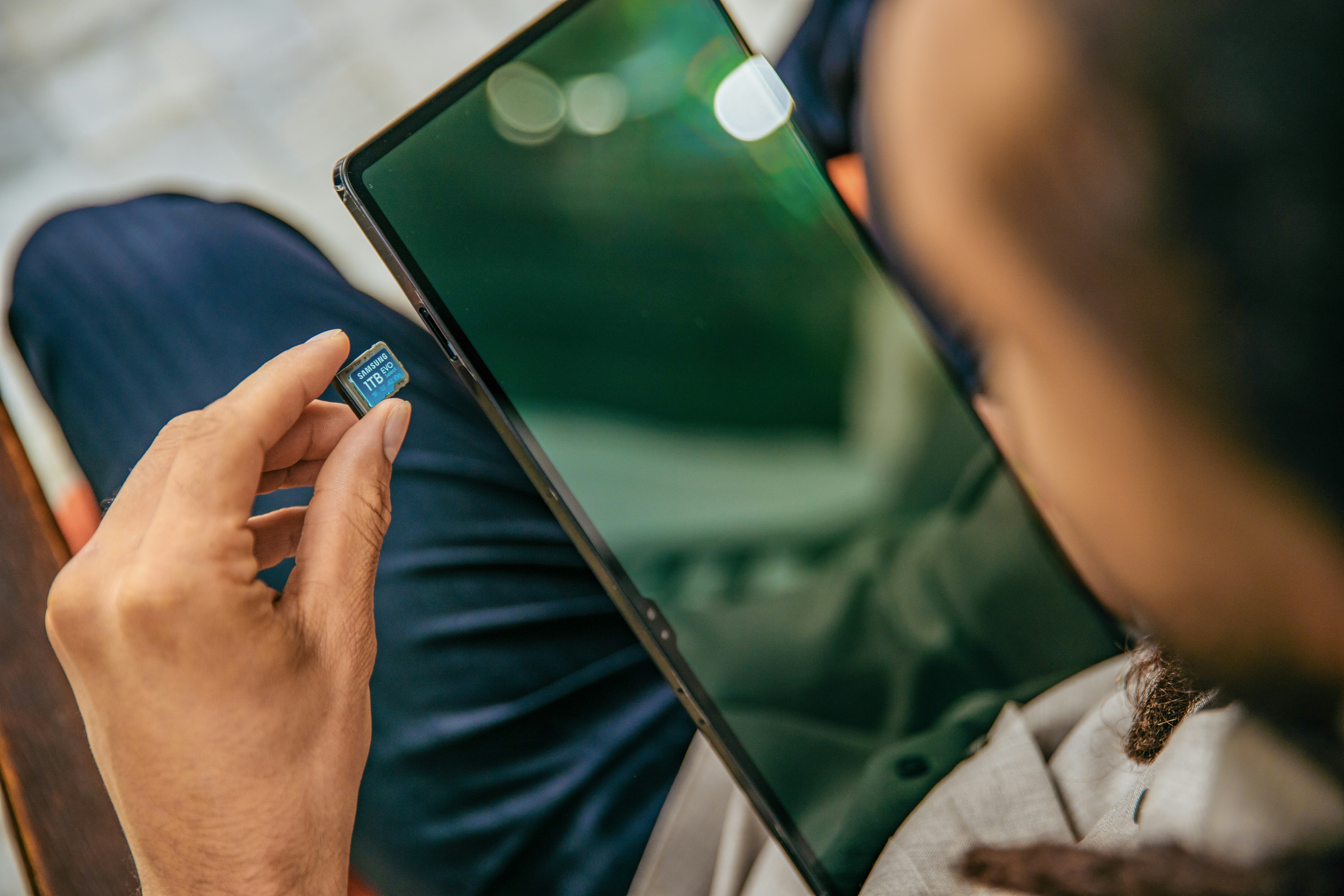 A person using a digital tablet to plan their monthly expenses and savings goals - zero based budget