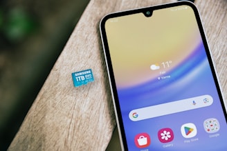 A close up of a cell phone on a table