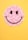 A smiley face made out of flowers on a yellow background