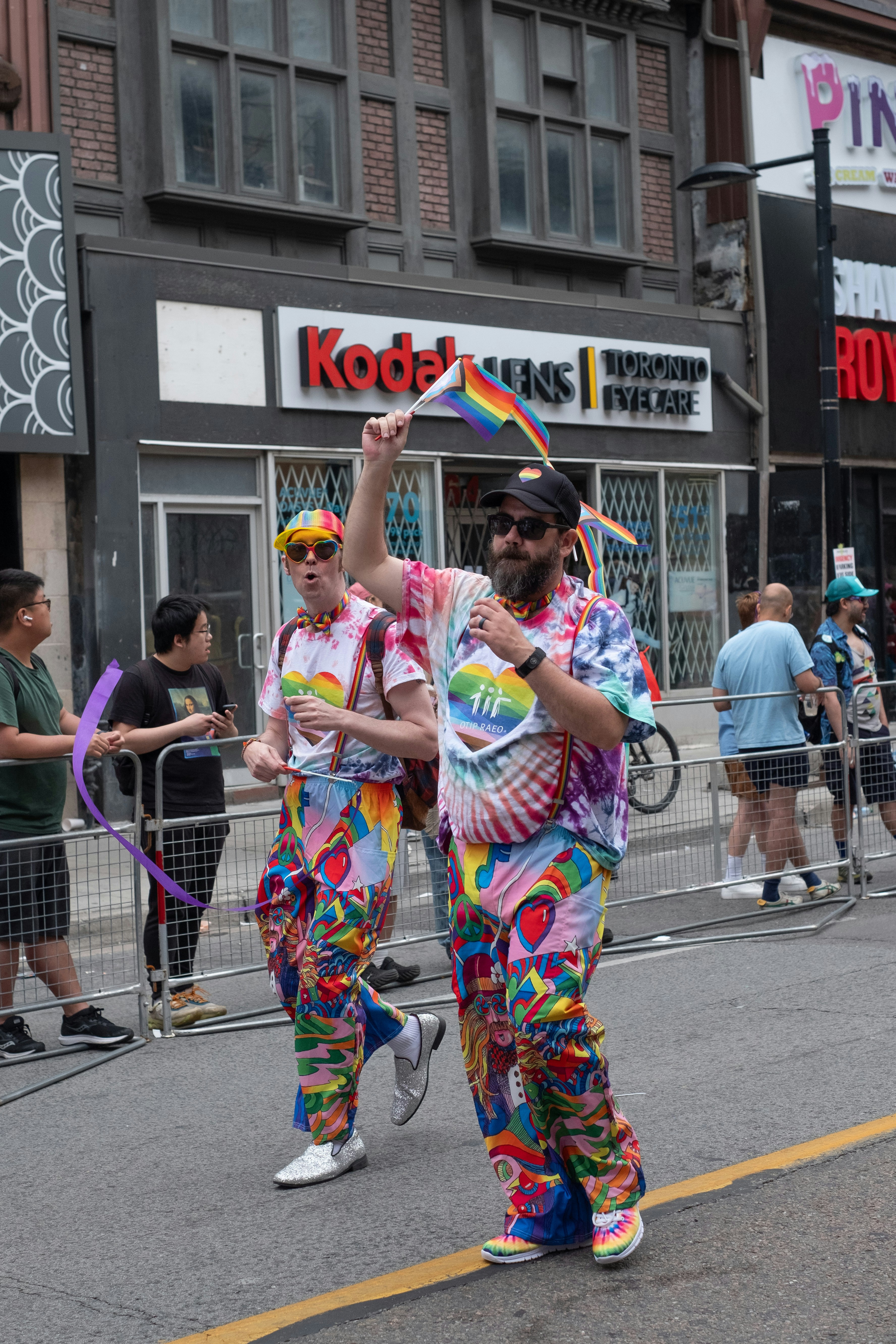 A couple of people that are standing in the street