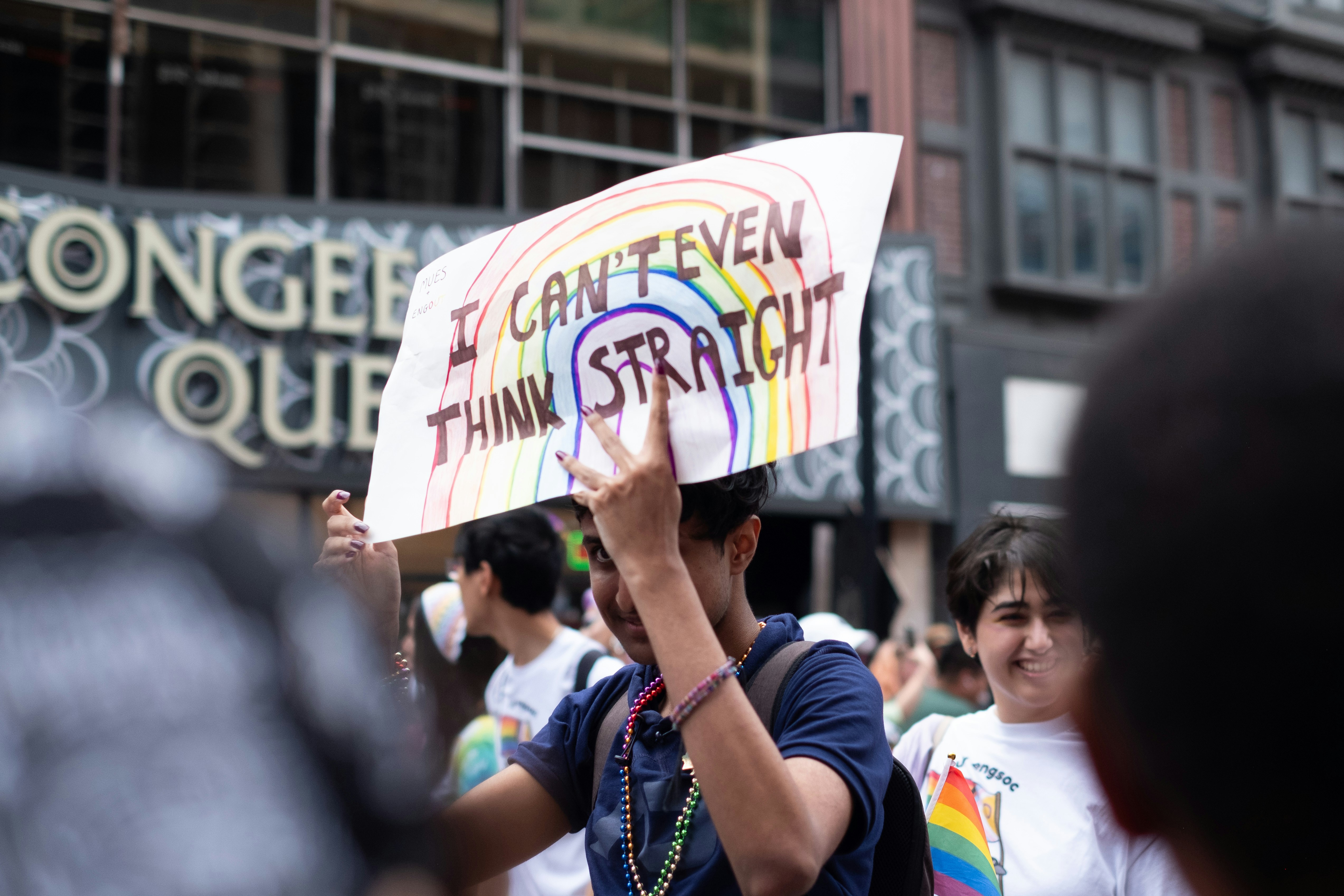 A man holding a sign in the middle of a crowd