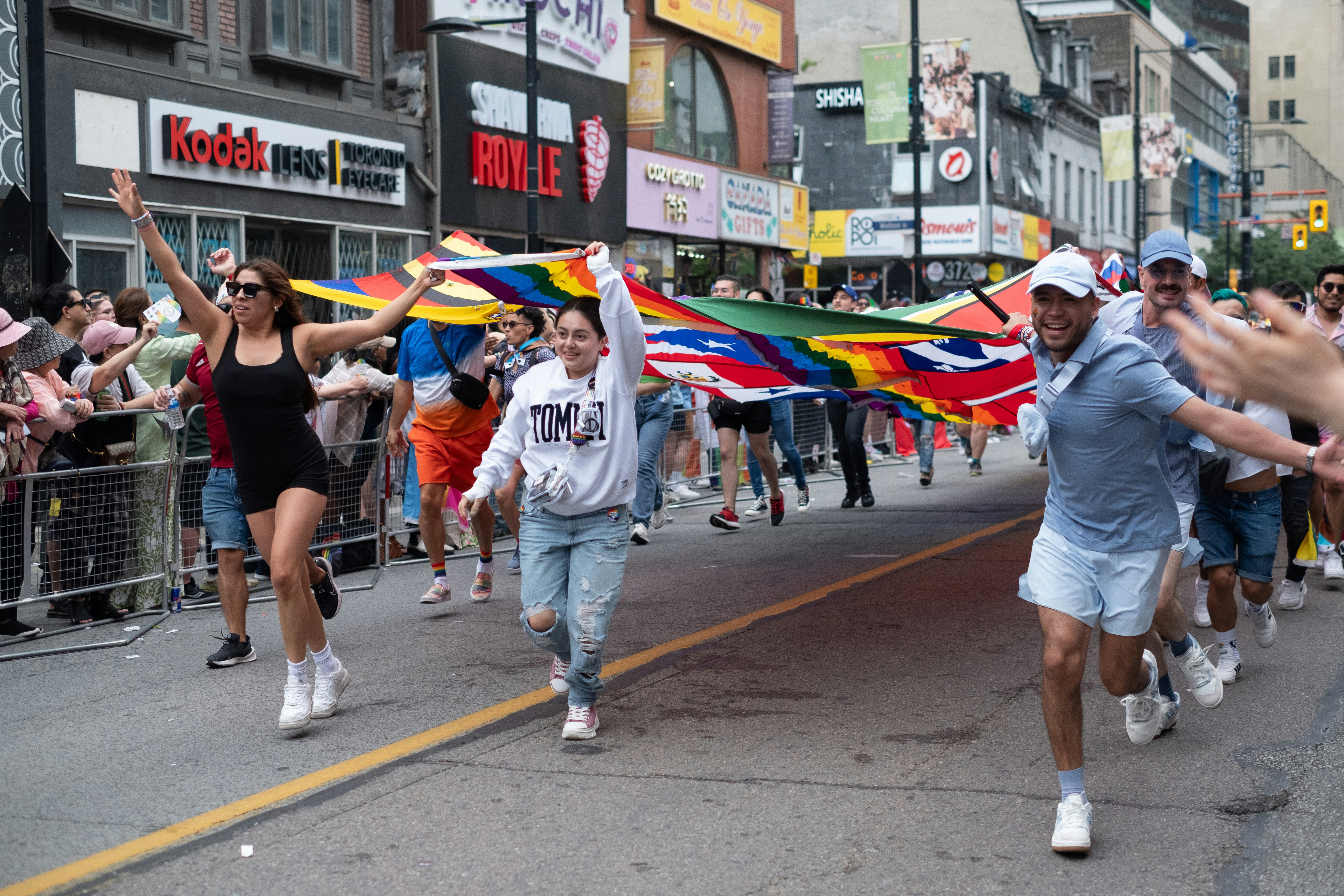 A large group of people walking down a street