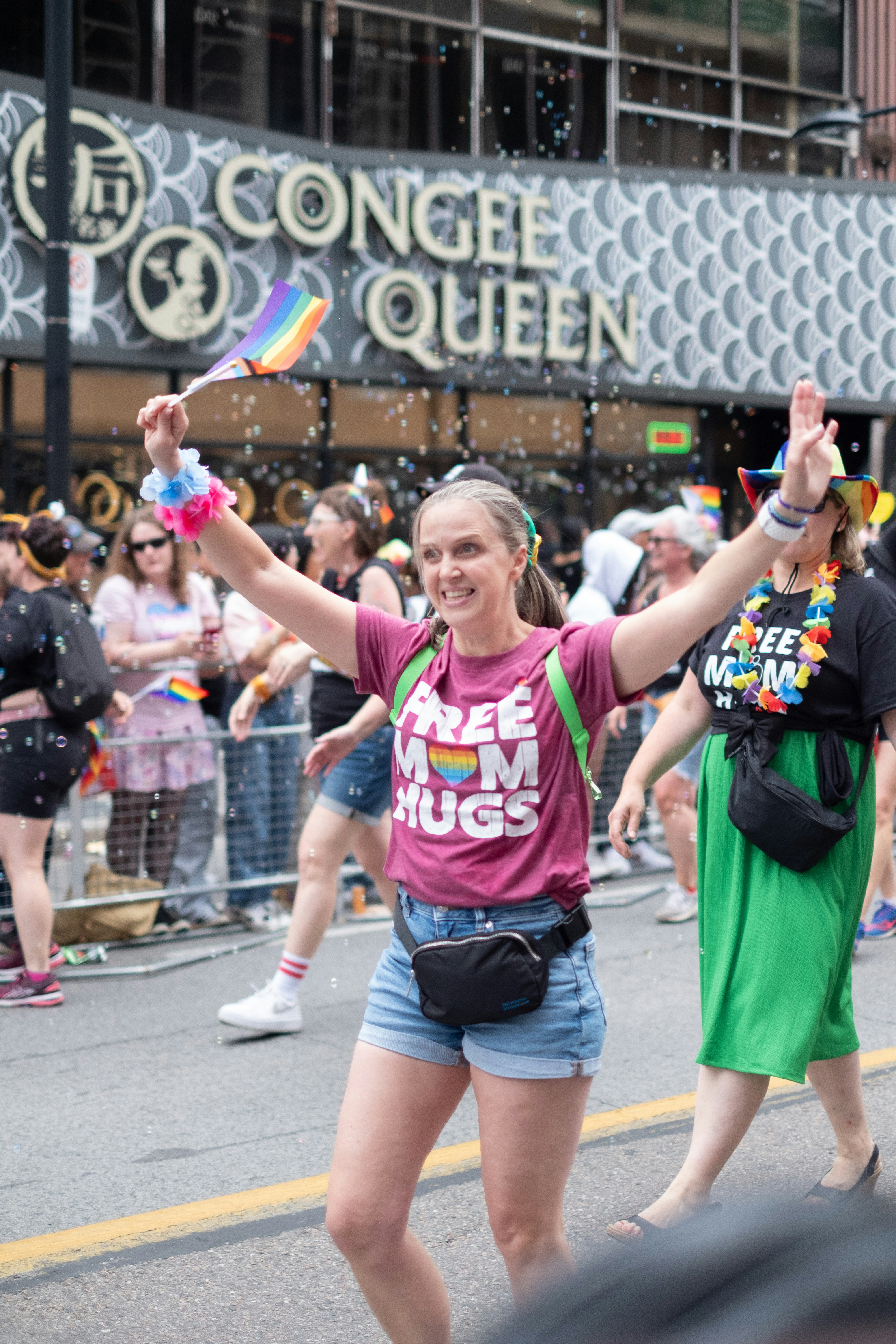 A group of people walking down a street