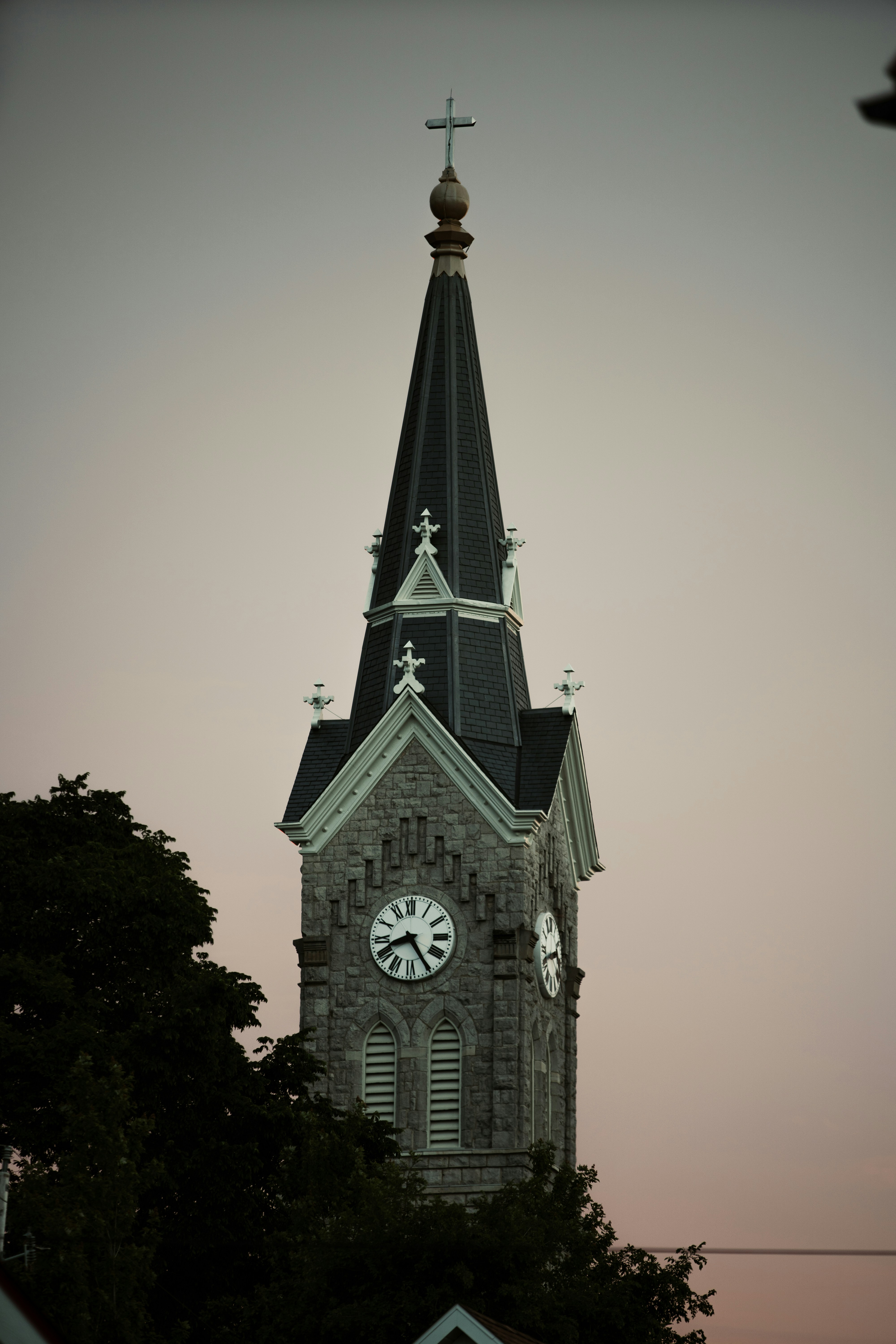 A church steeple with a clock on it