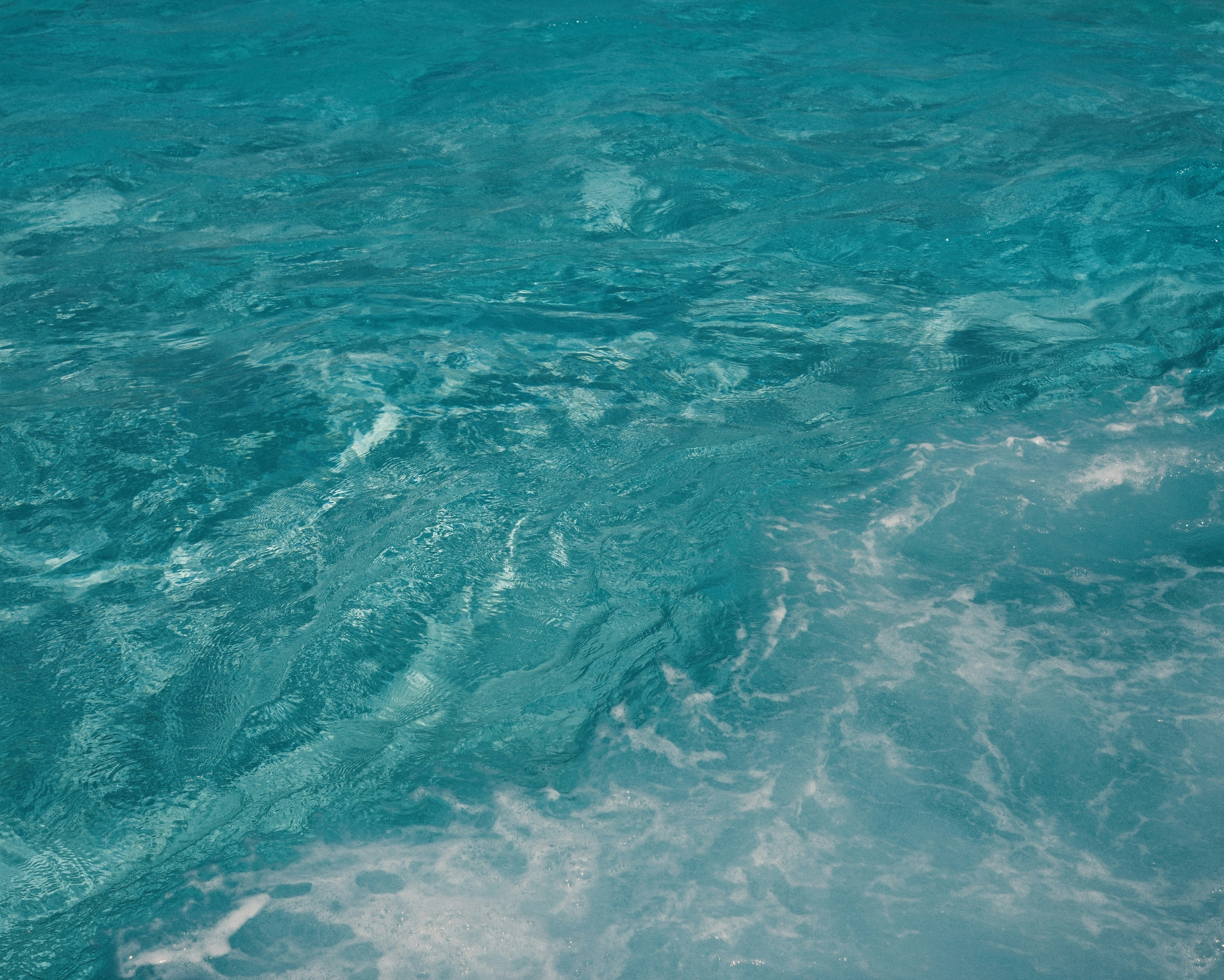 A man riding a wave on top of a surfboard