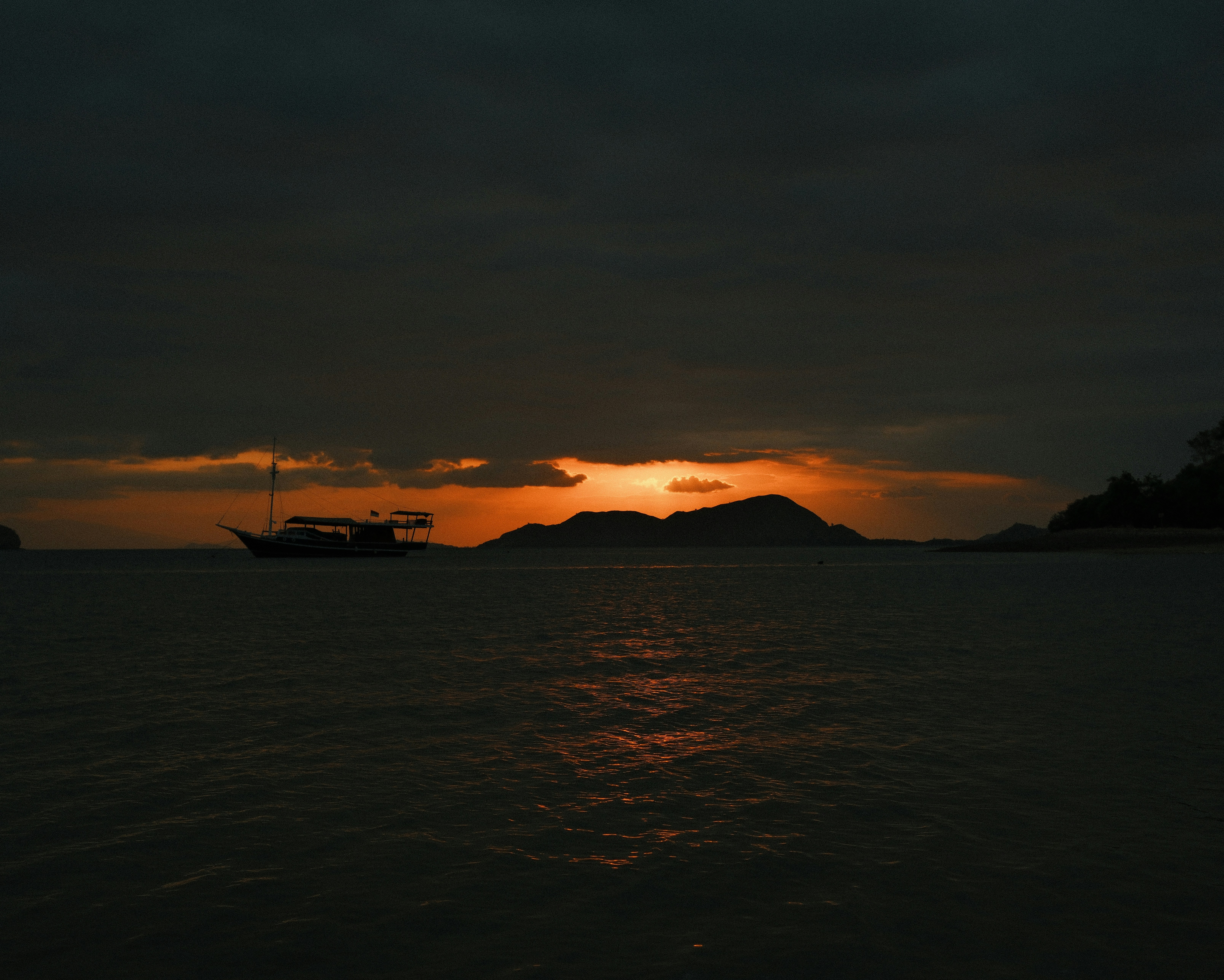 The sun is setting over a body of water