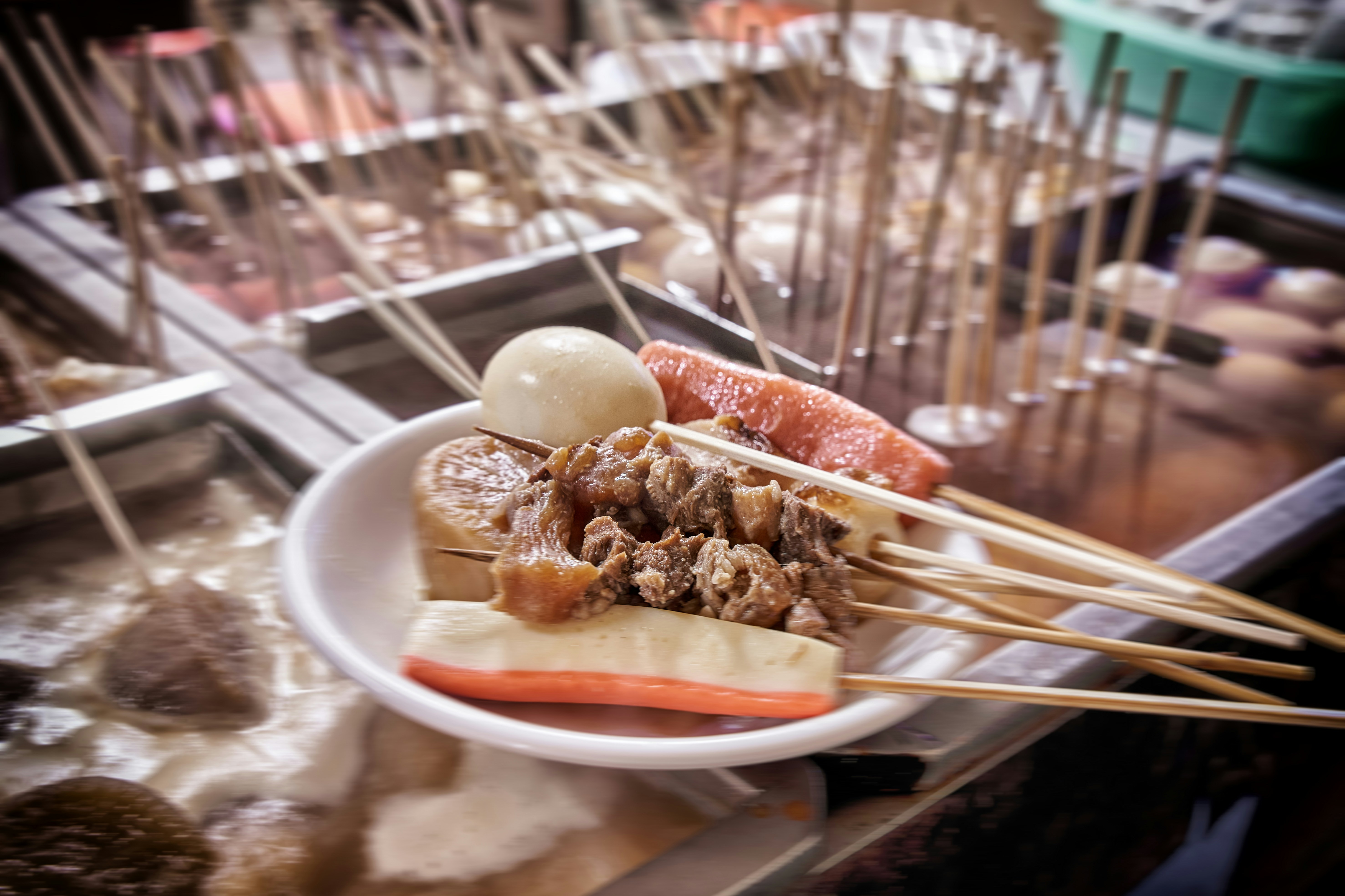 A white plate topped with meat and veggies