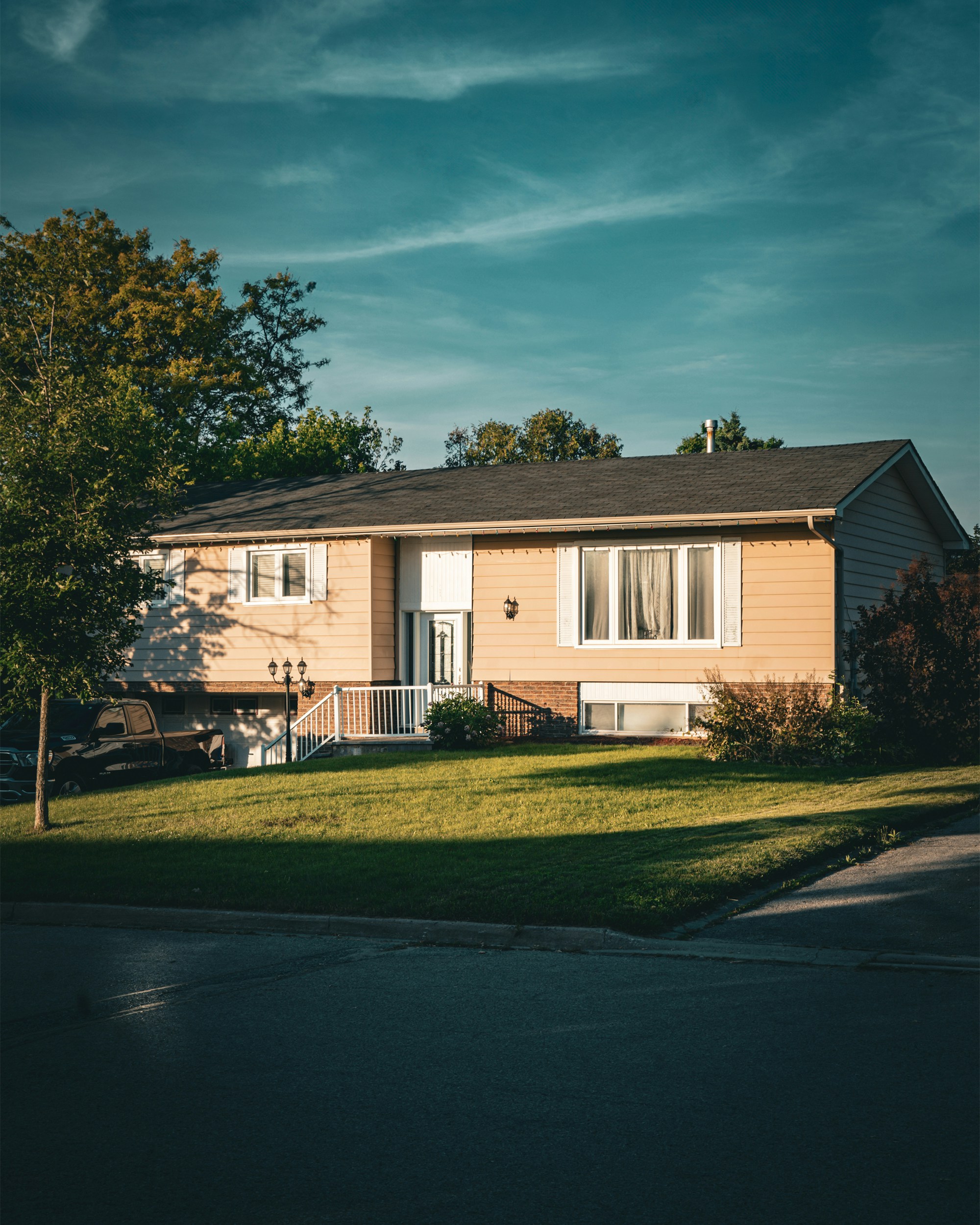 A house sitting on the side of a road