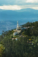 A church on a hill with a view of the city below