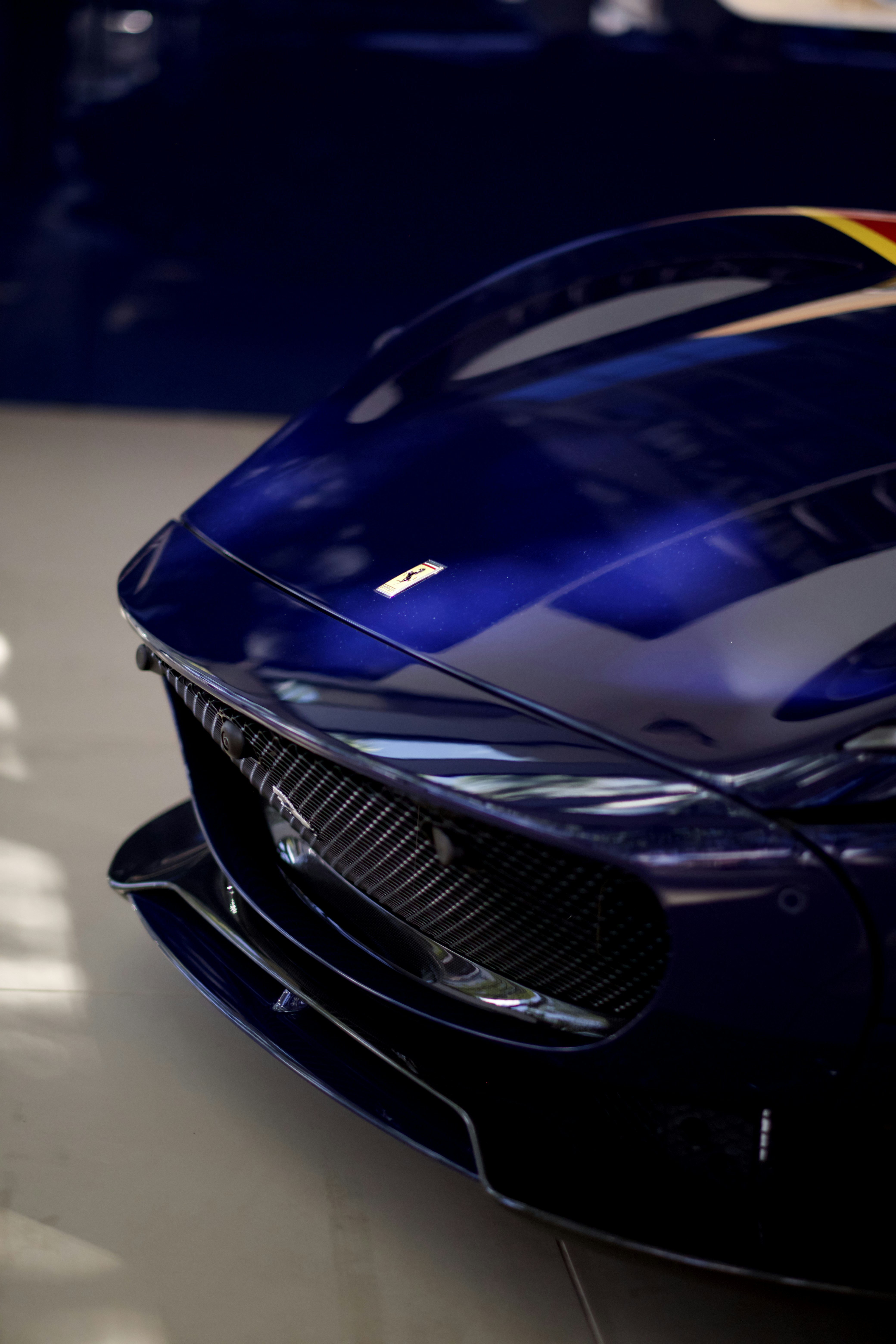 A blue sports car parked in a garage
