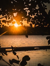 The sun is setting over a body of water