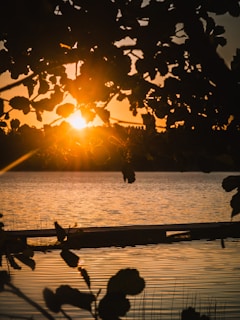 The sun is setting over a body of water