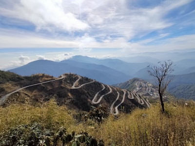 A view of a winding road in the mountains