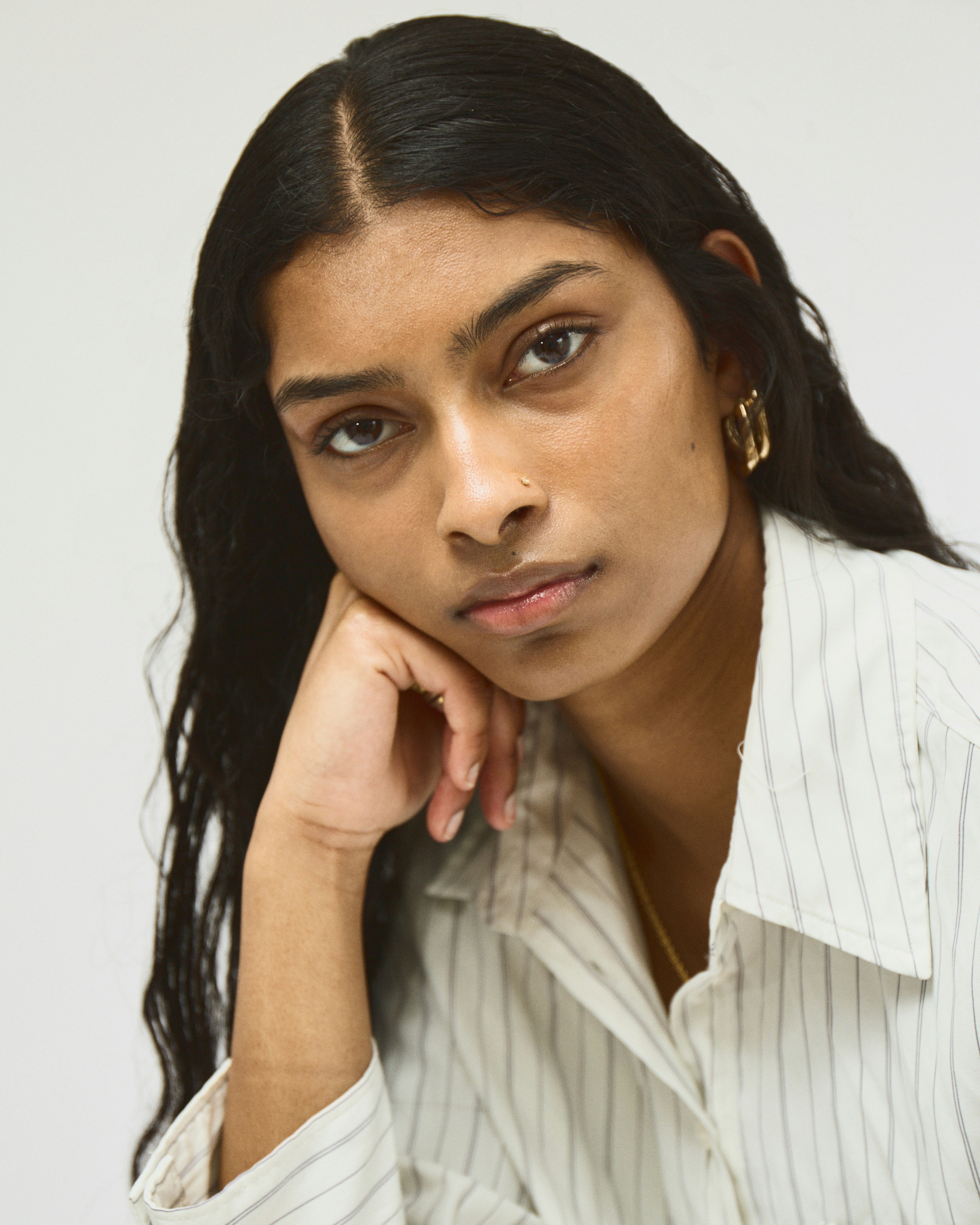 A woman in a white shirt posing for a picture photo – Free Photography ...