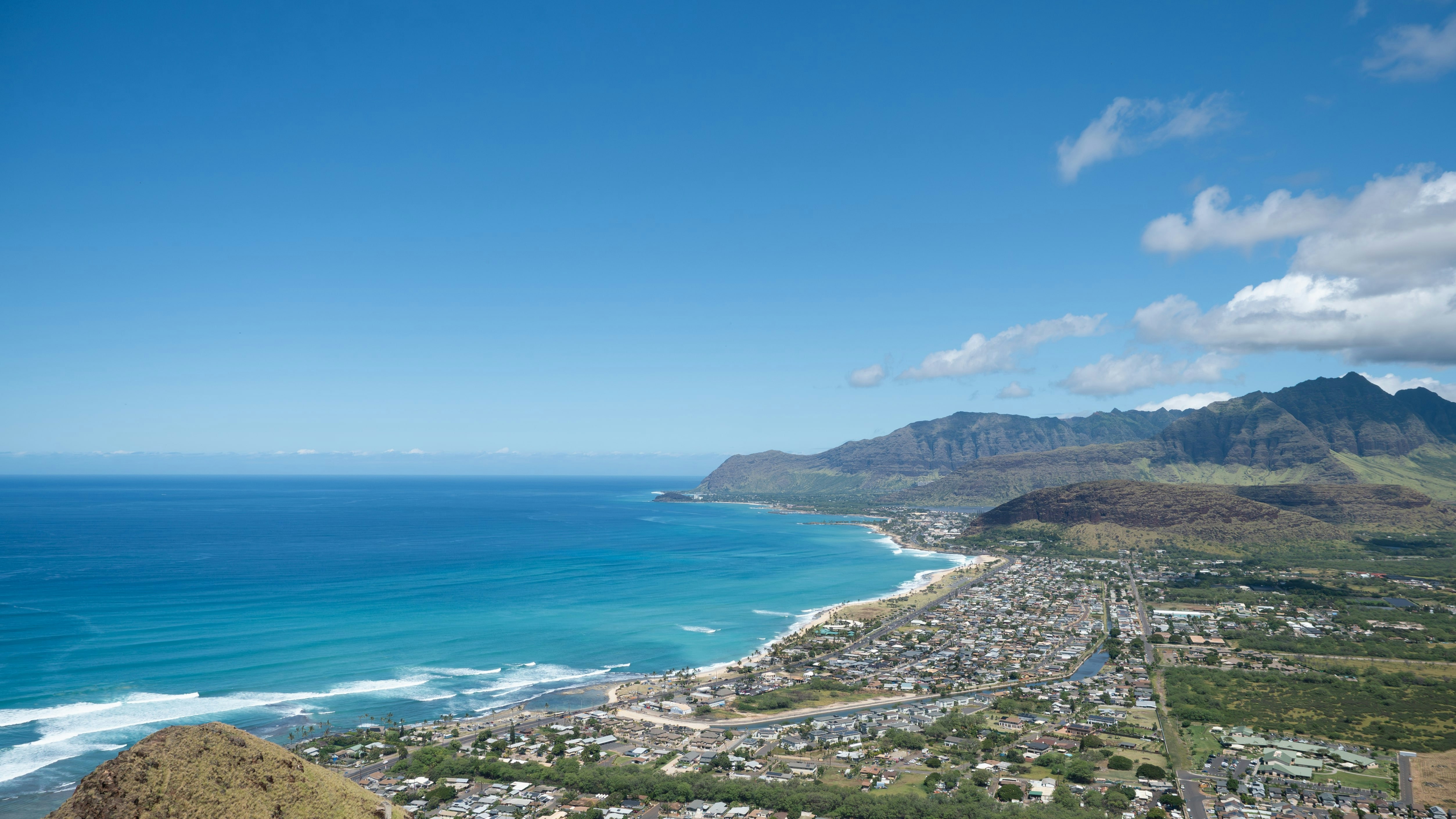 A scenic view of a city and the ocean