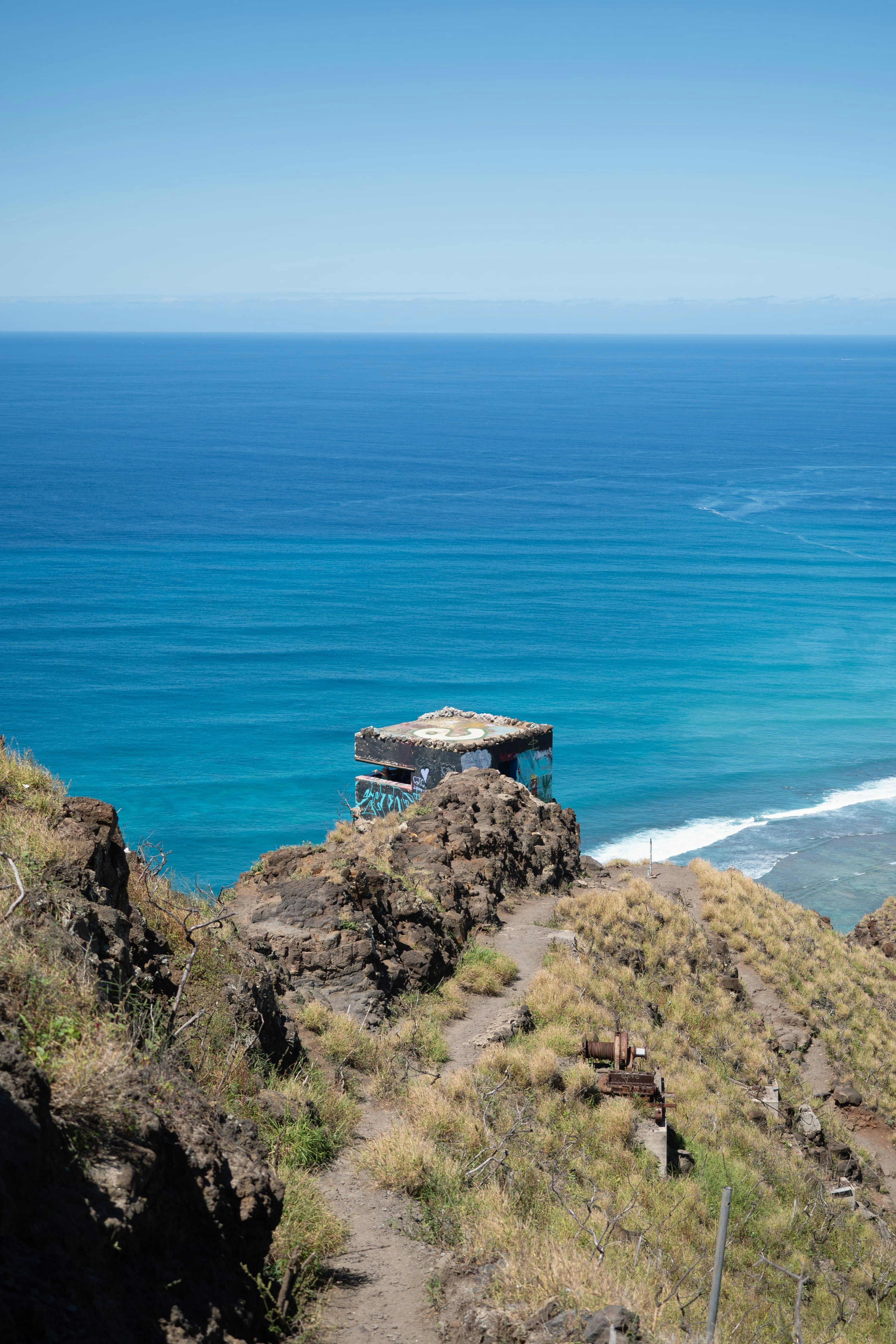 A view of the ocean from the top of a hill