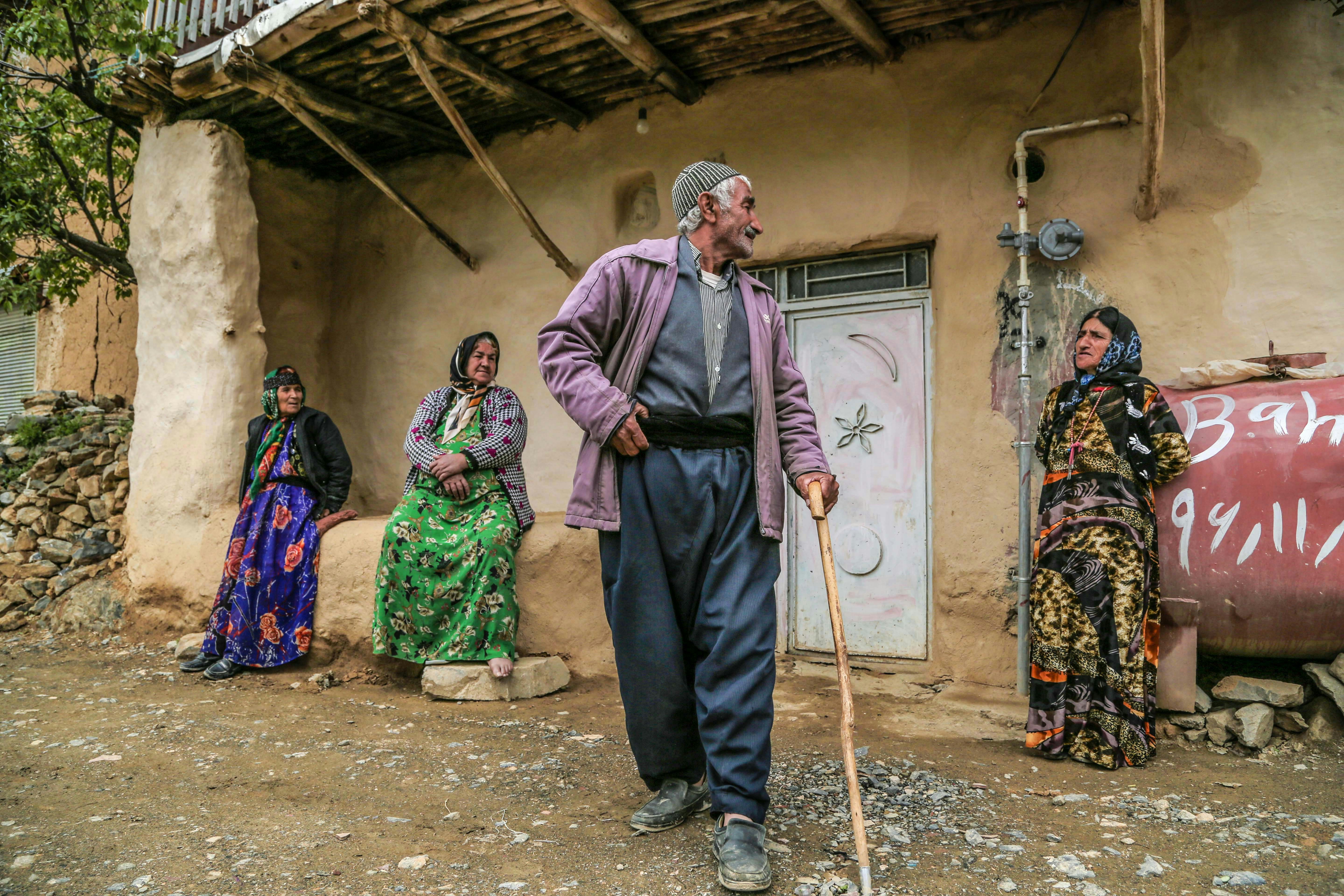 A group of people standing outside of a building