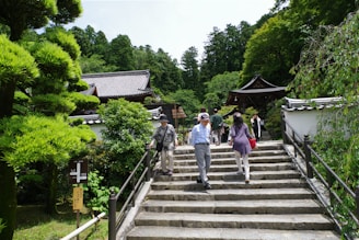 A group of people walking down a set of stairs