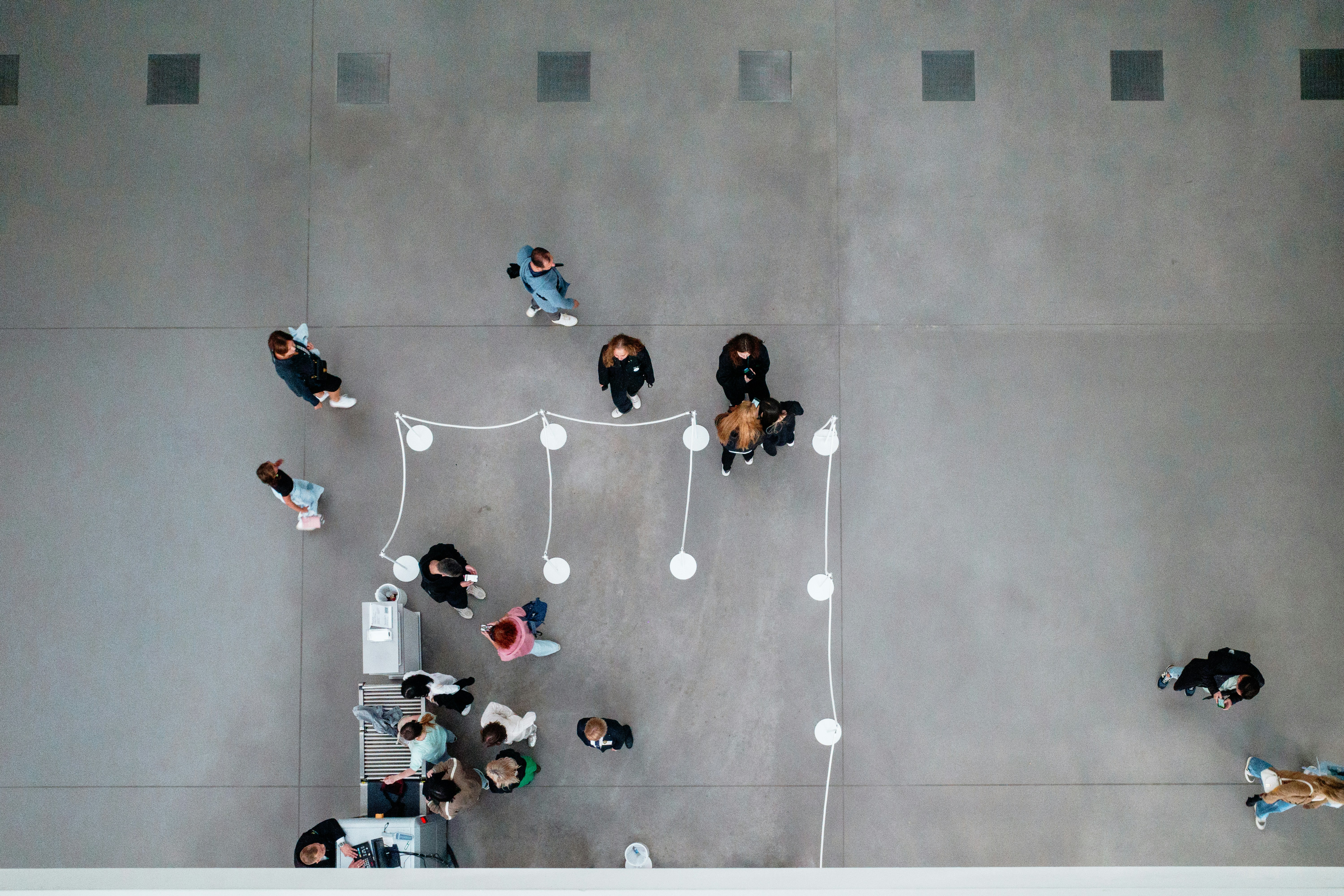 A group of people standing around a building