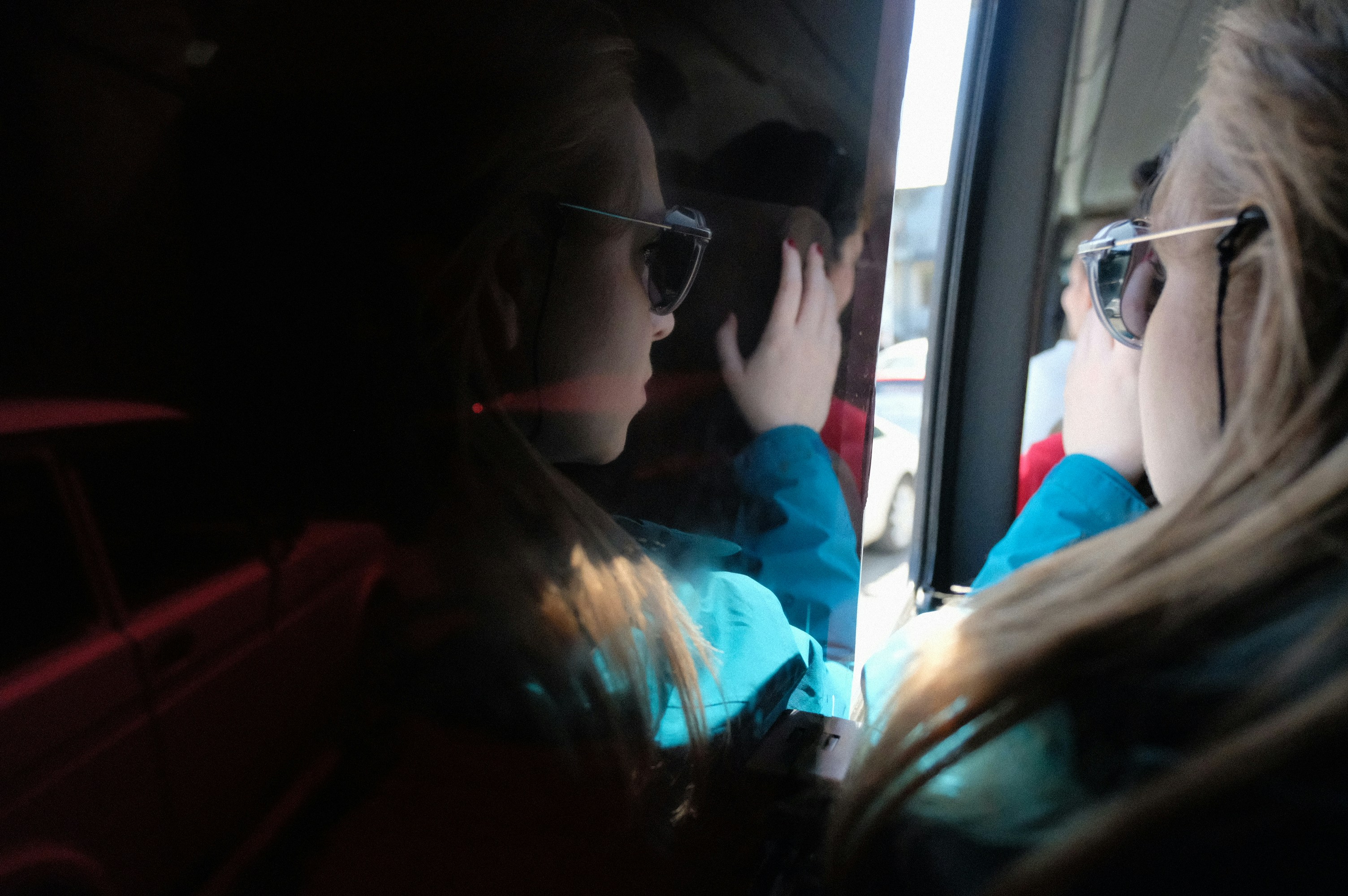 Group of friends enjoying a comfortable bus journey - bus rental for group trip