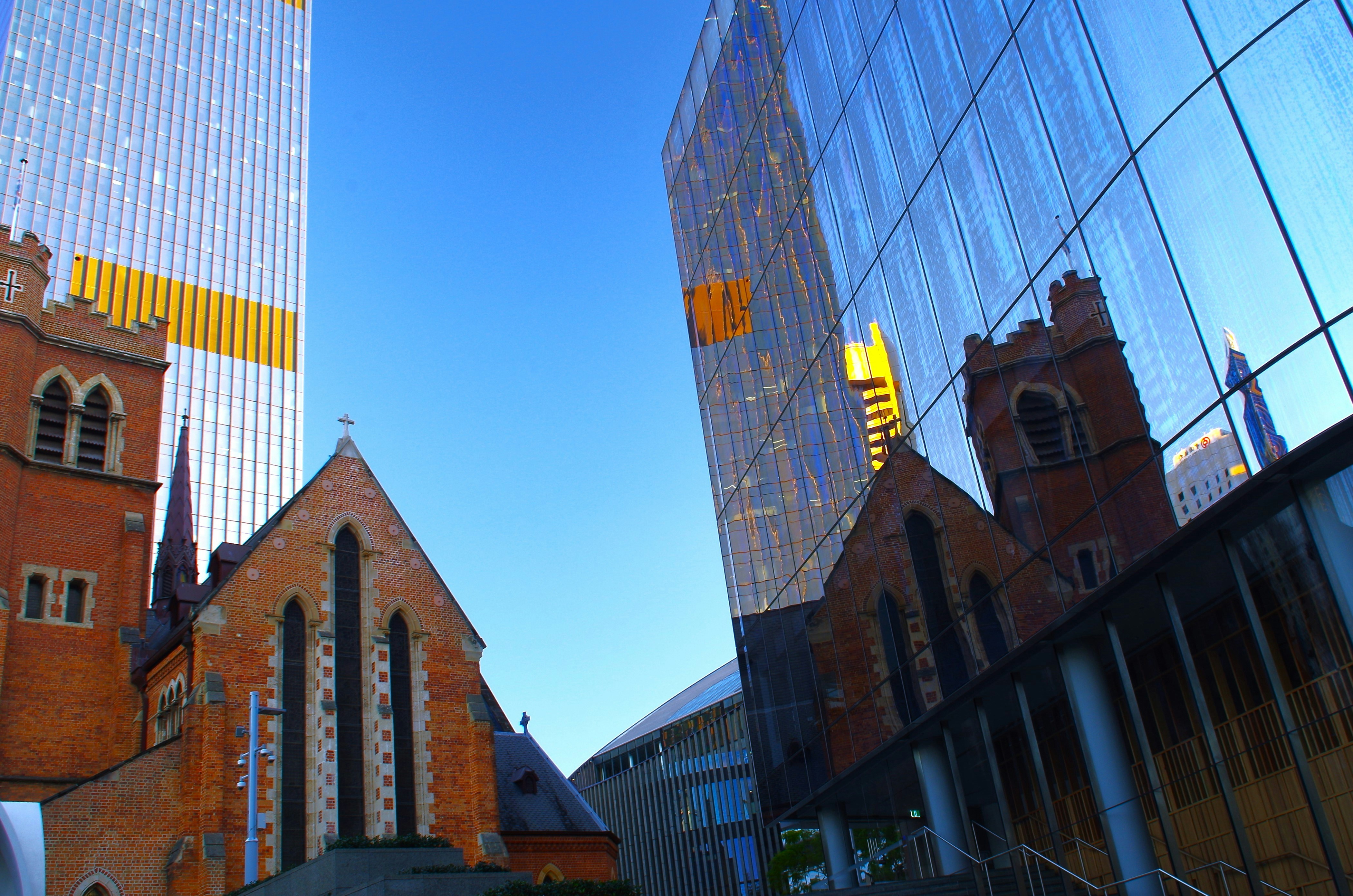 A picture of a church in the middle of a city