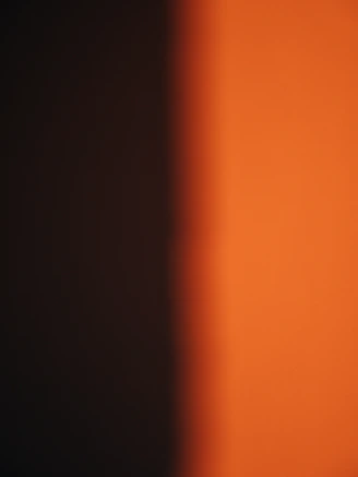 A blurry photo of an orange wall