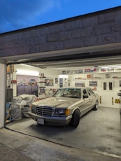 A car is parked inside of a garage
