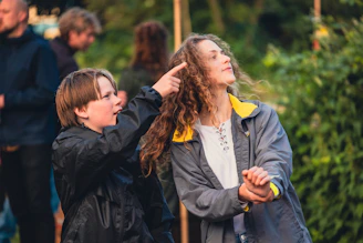 A woman helping a child with her hair