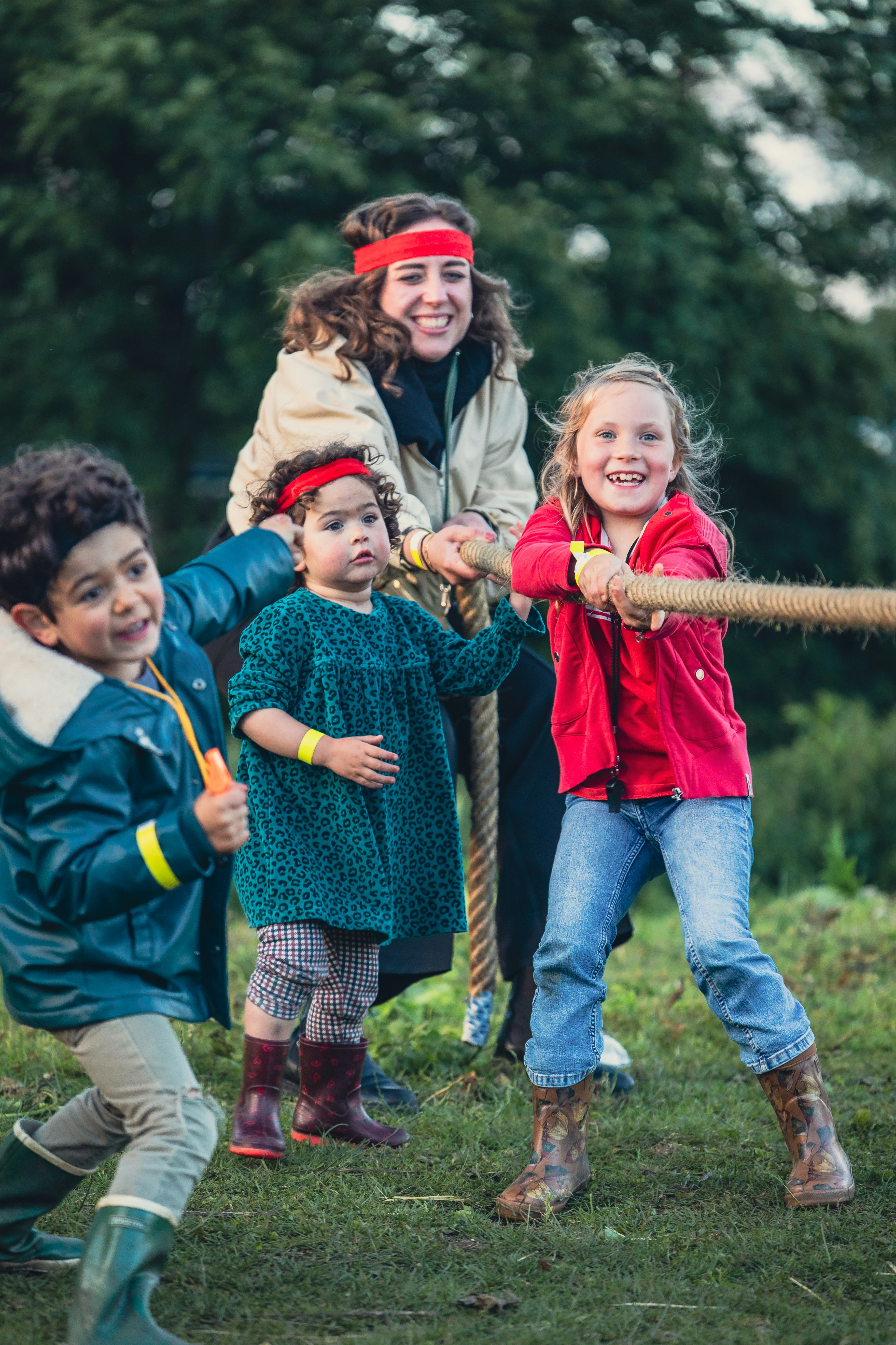 A group of children playing tug of war