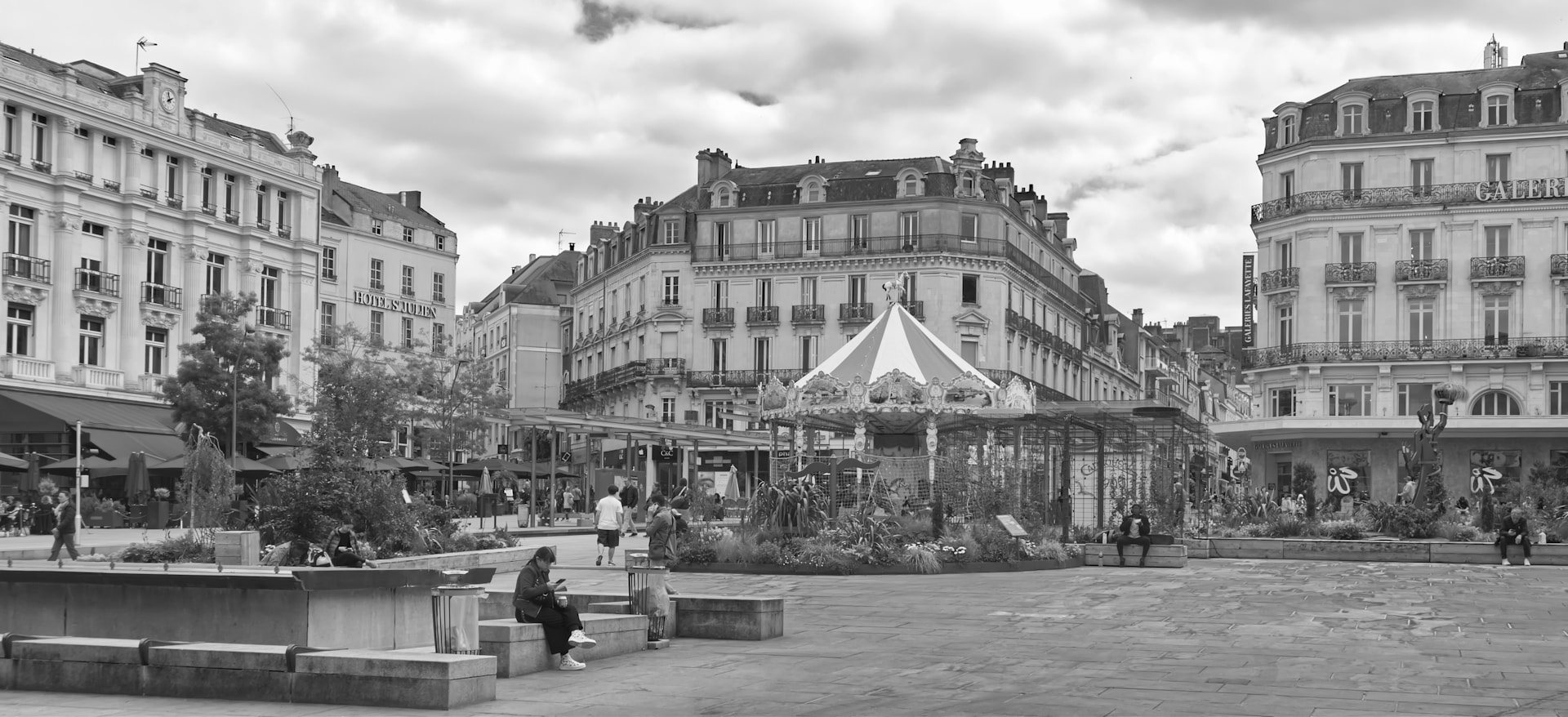 A black and white photo of a city square