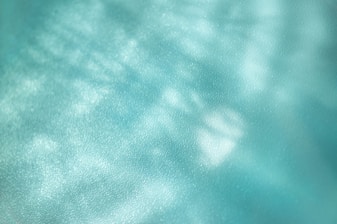 A blurry photo of a blue sky with clouds