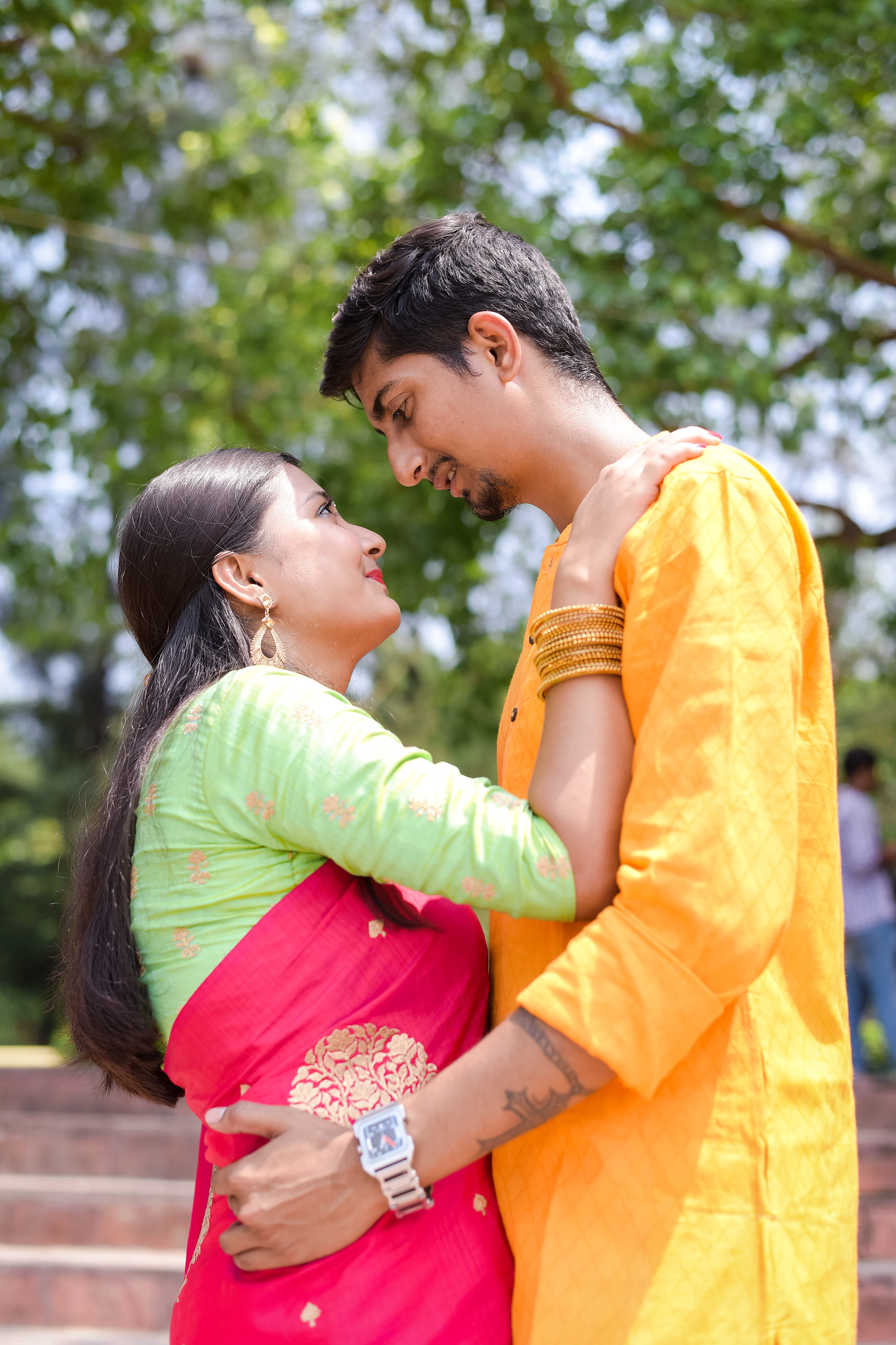 Couple standing together on a wide film set