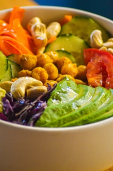 A white bowl filled with different types of vegetables