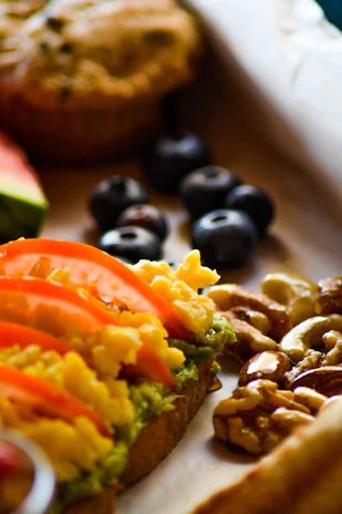 A close up of a sandwich with fruit and nuts