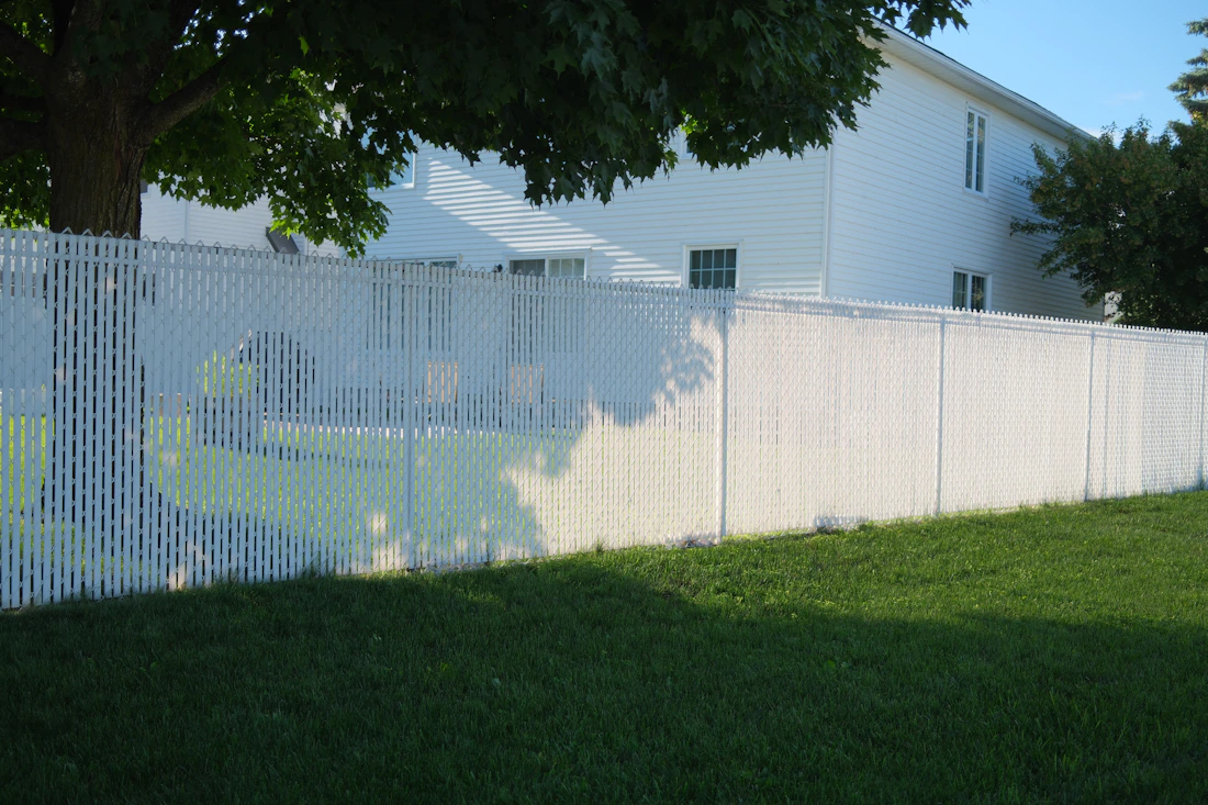 White vinyl fencing outside a home