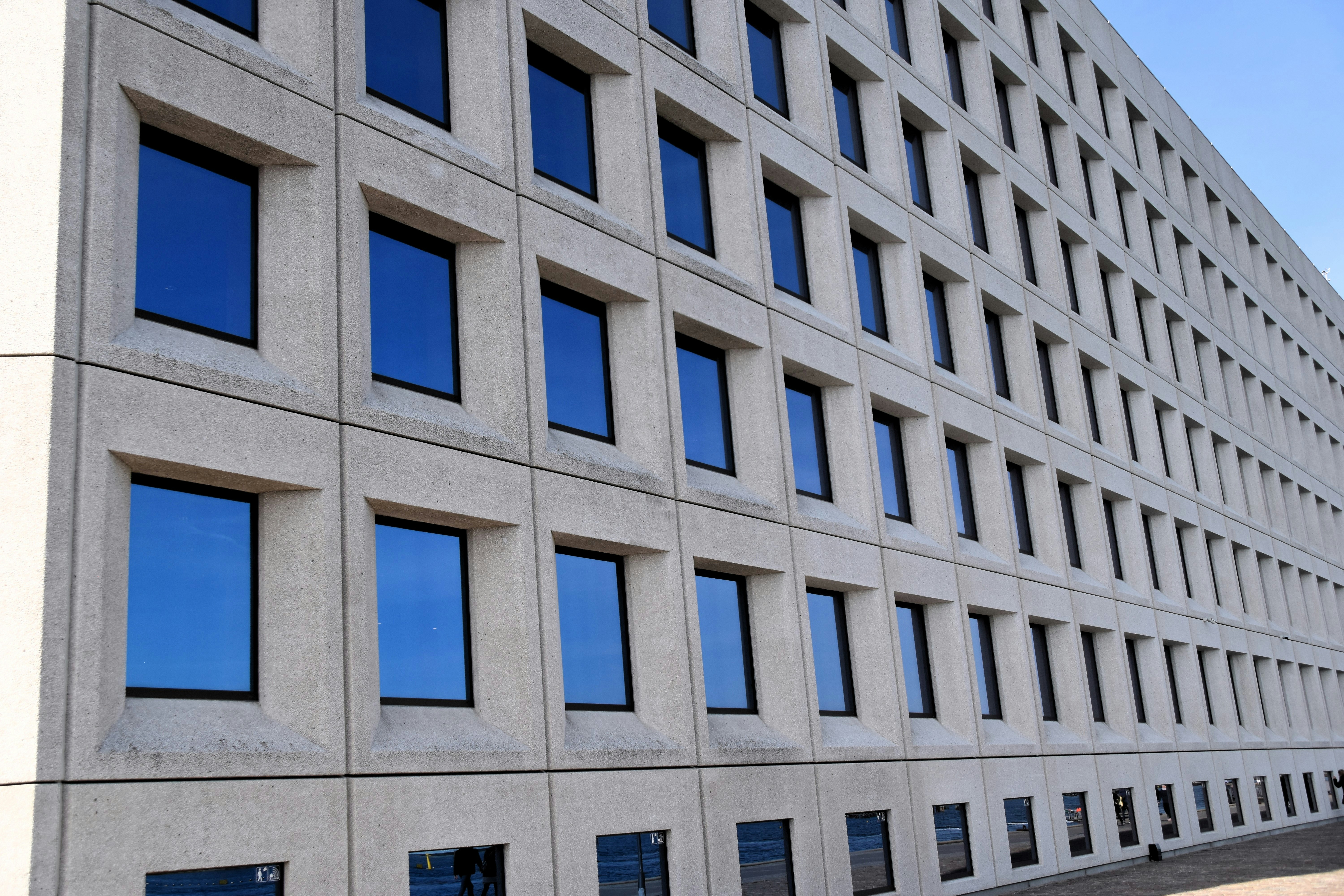 A large building with many windows on the side of it