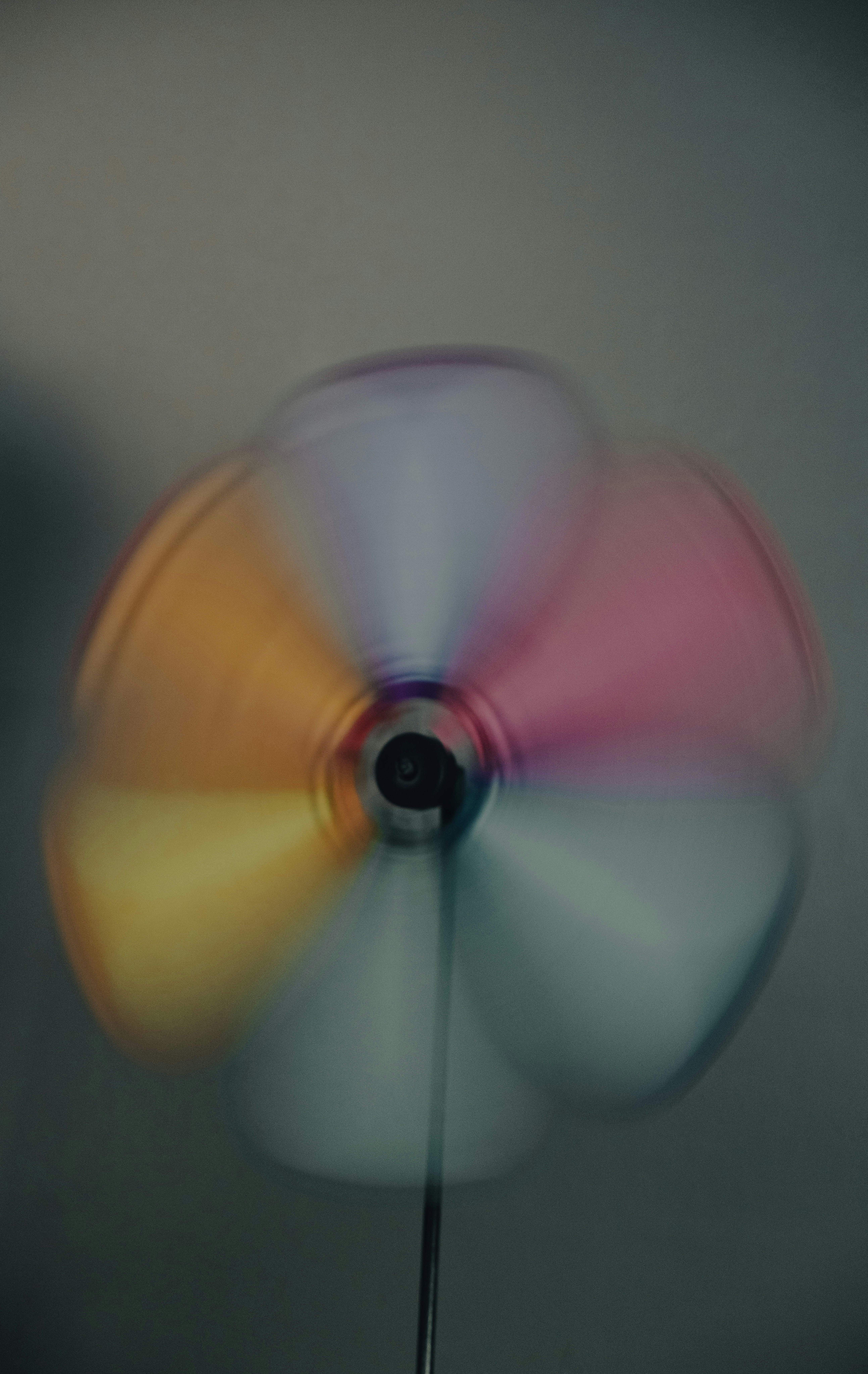 A multicolored spinning object in a room