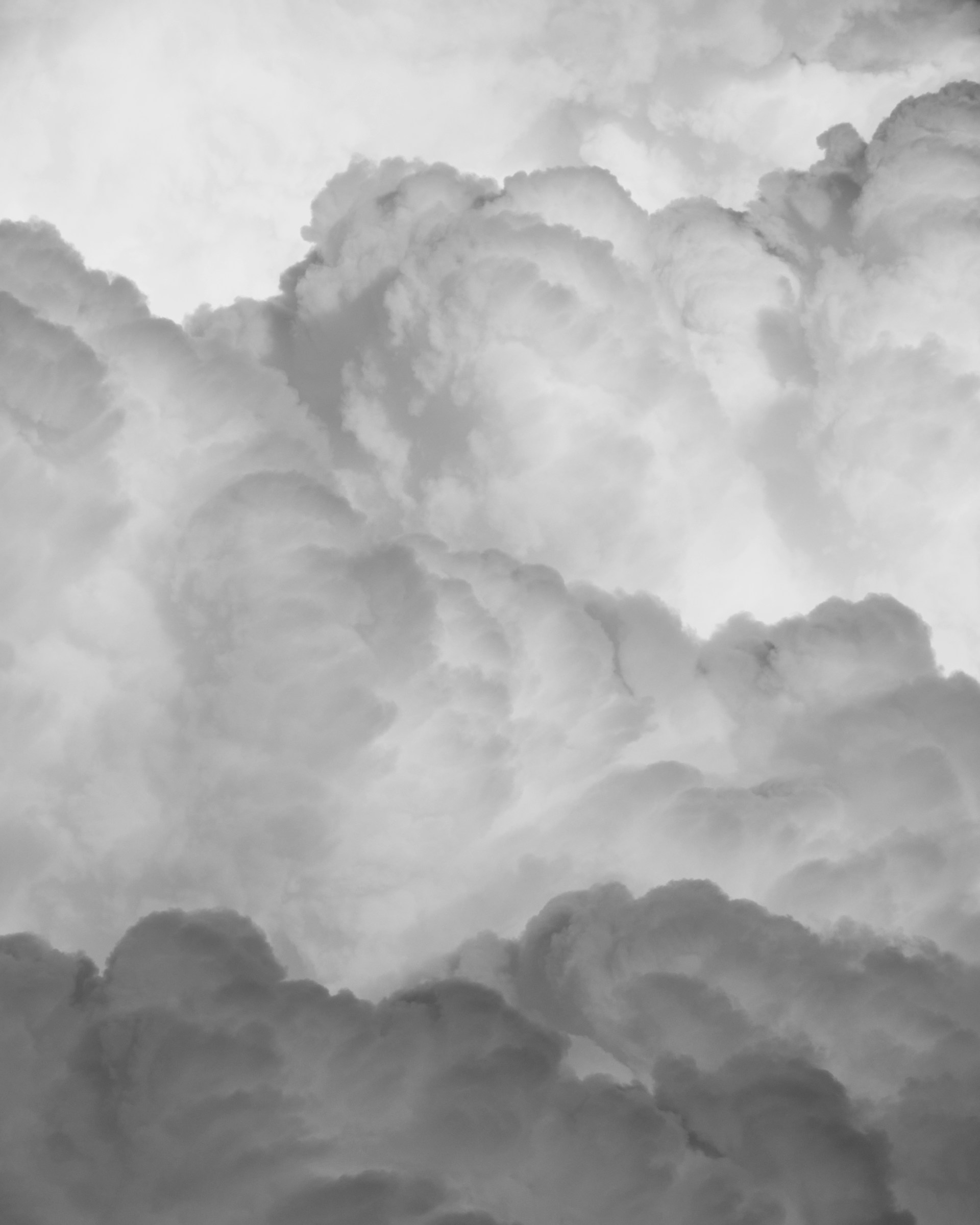 A black and white photo of clouds in the sky