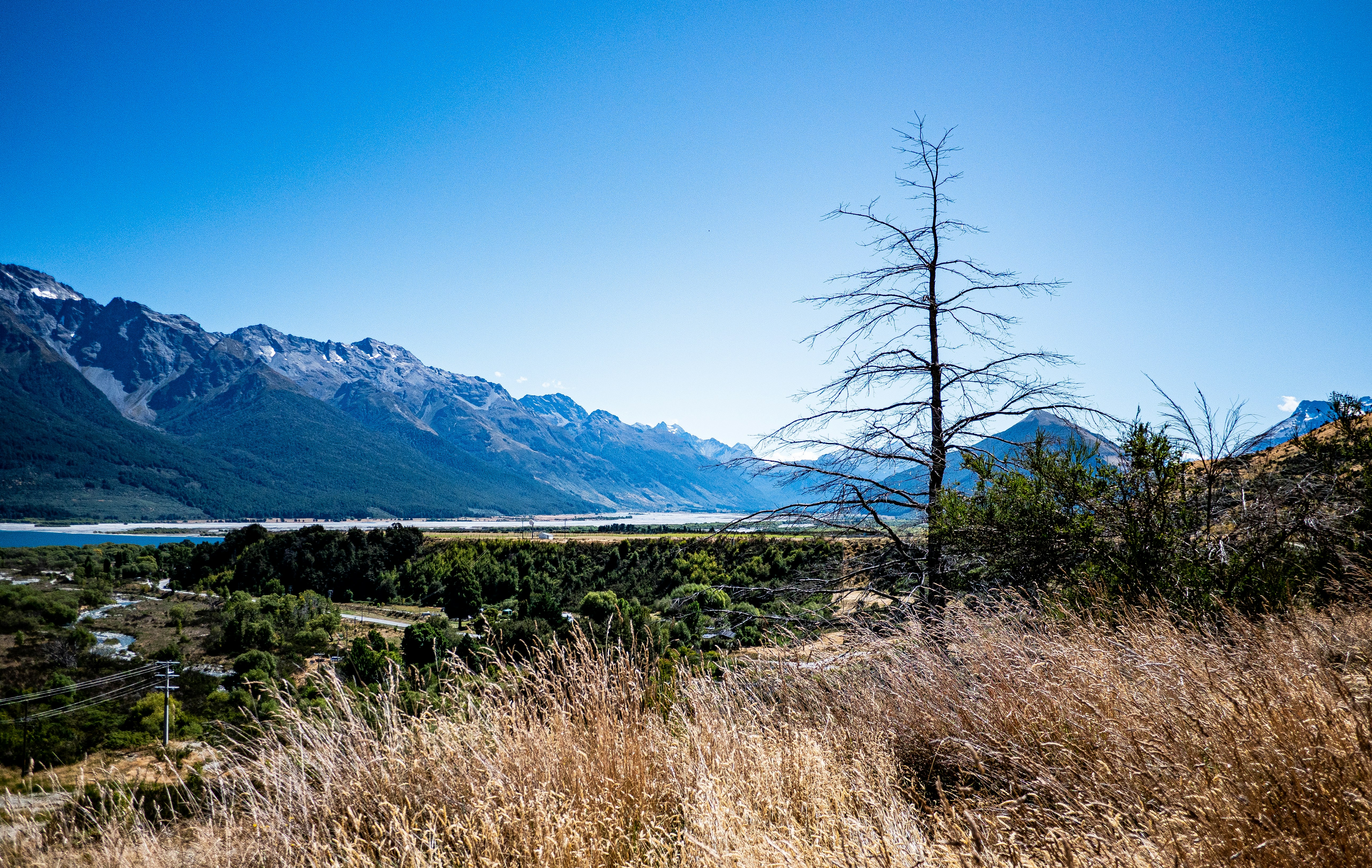 A view of a valley with mountains in the background