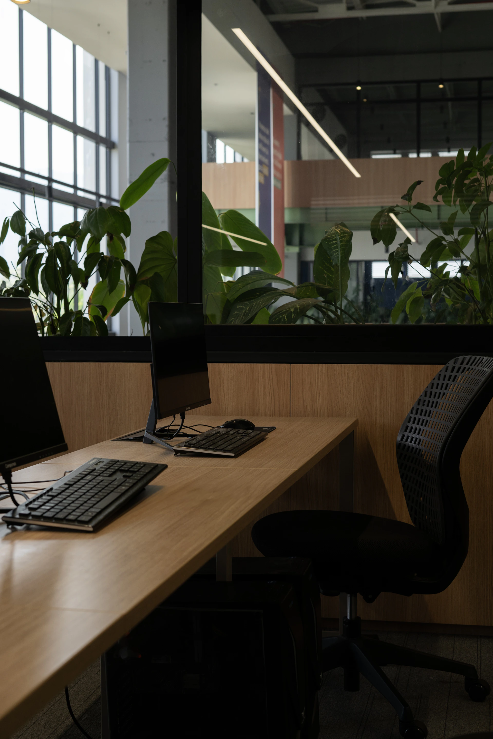 A desk with a computer and a keyboard on it