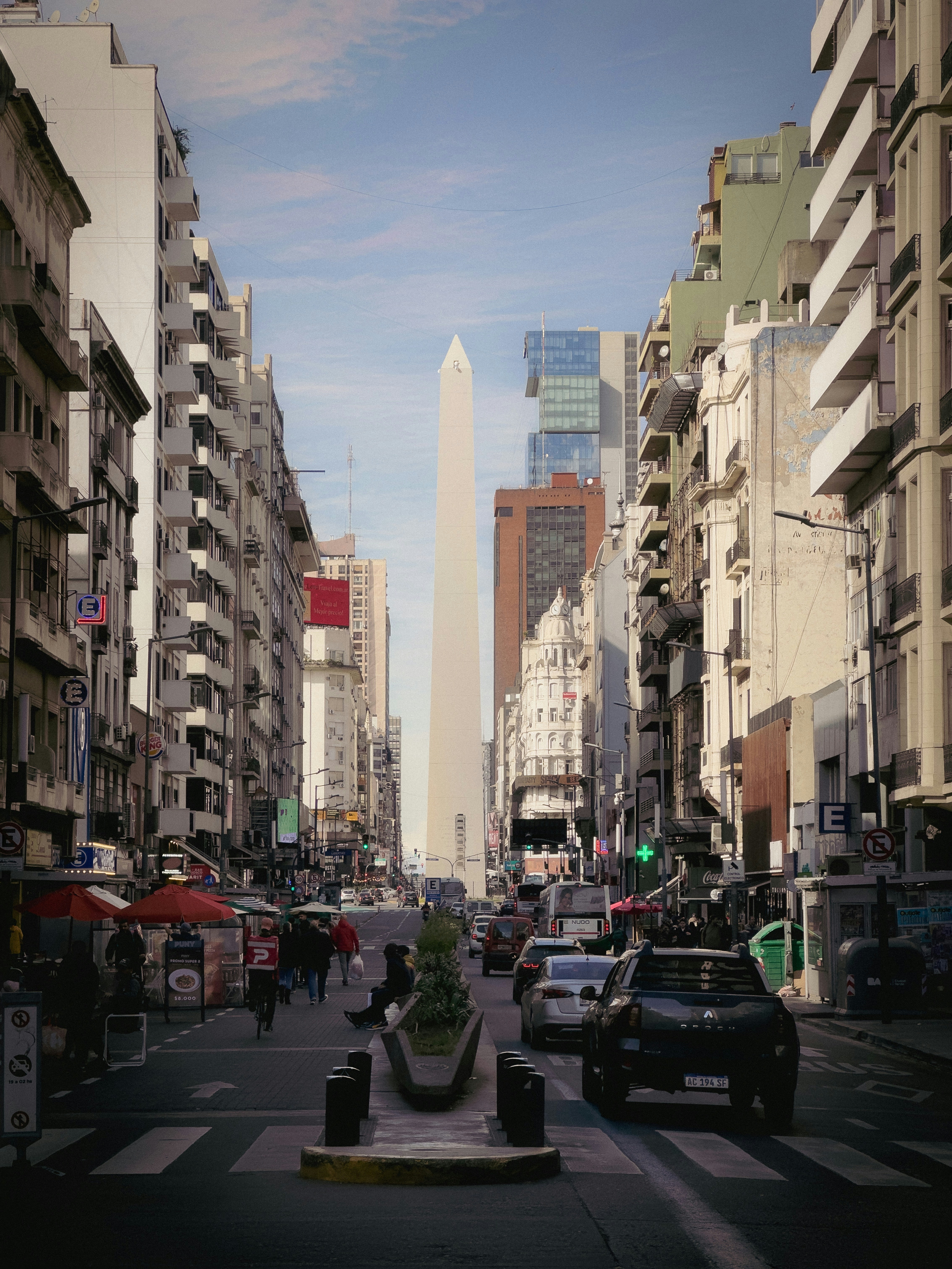 A city street filled with lots of tall buildings