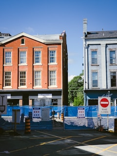 A street corner with a building in the background