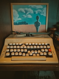 An old fashioned typewriter sitting on a desk